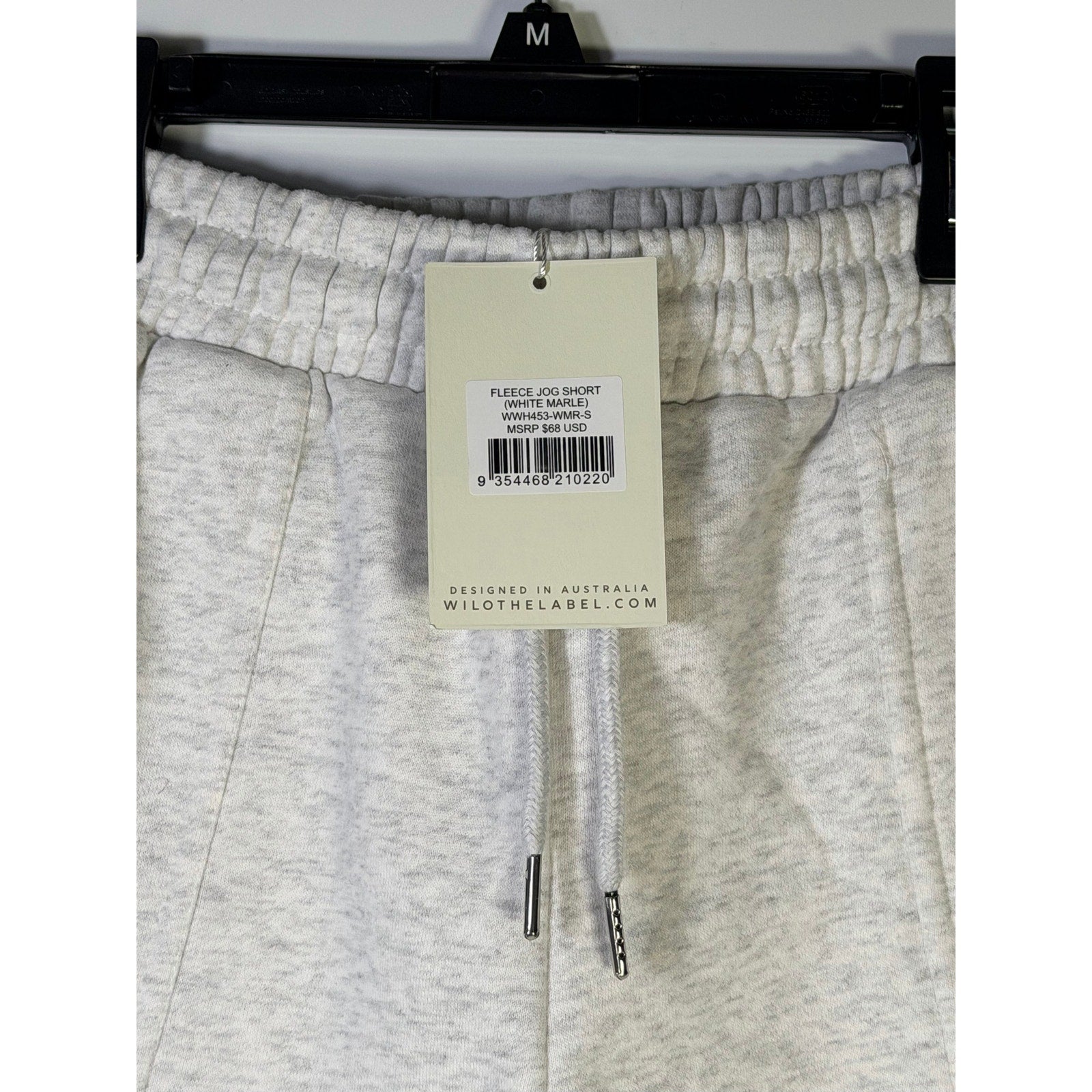 WILO women's fleece jog shorts in white marle, size M, laid flat showing soft fabric and relaxed fit.