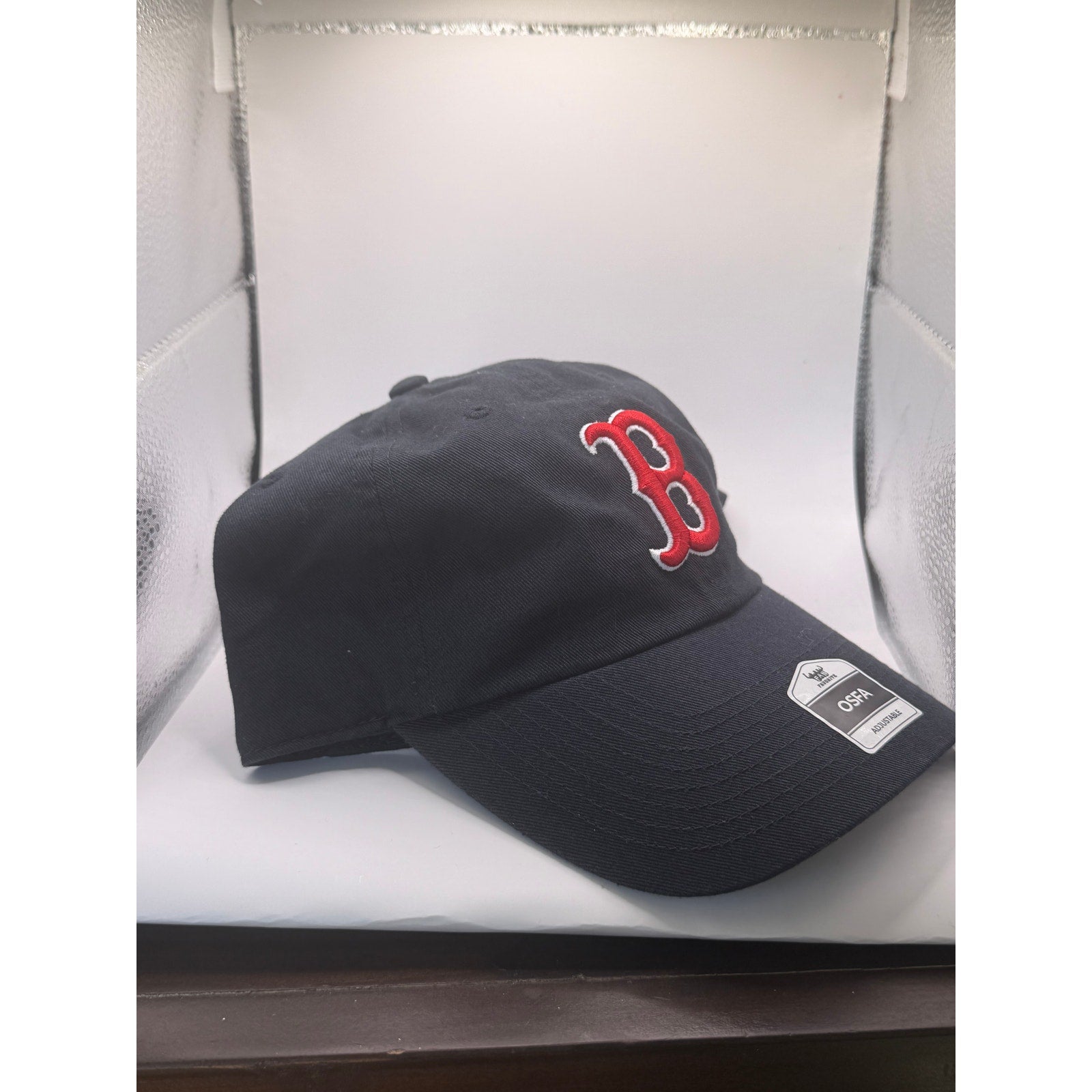 New Era Boston Red Sox MLB Clean Up adjustable dad hat cap in black with red team logo on front.