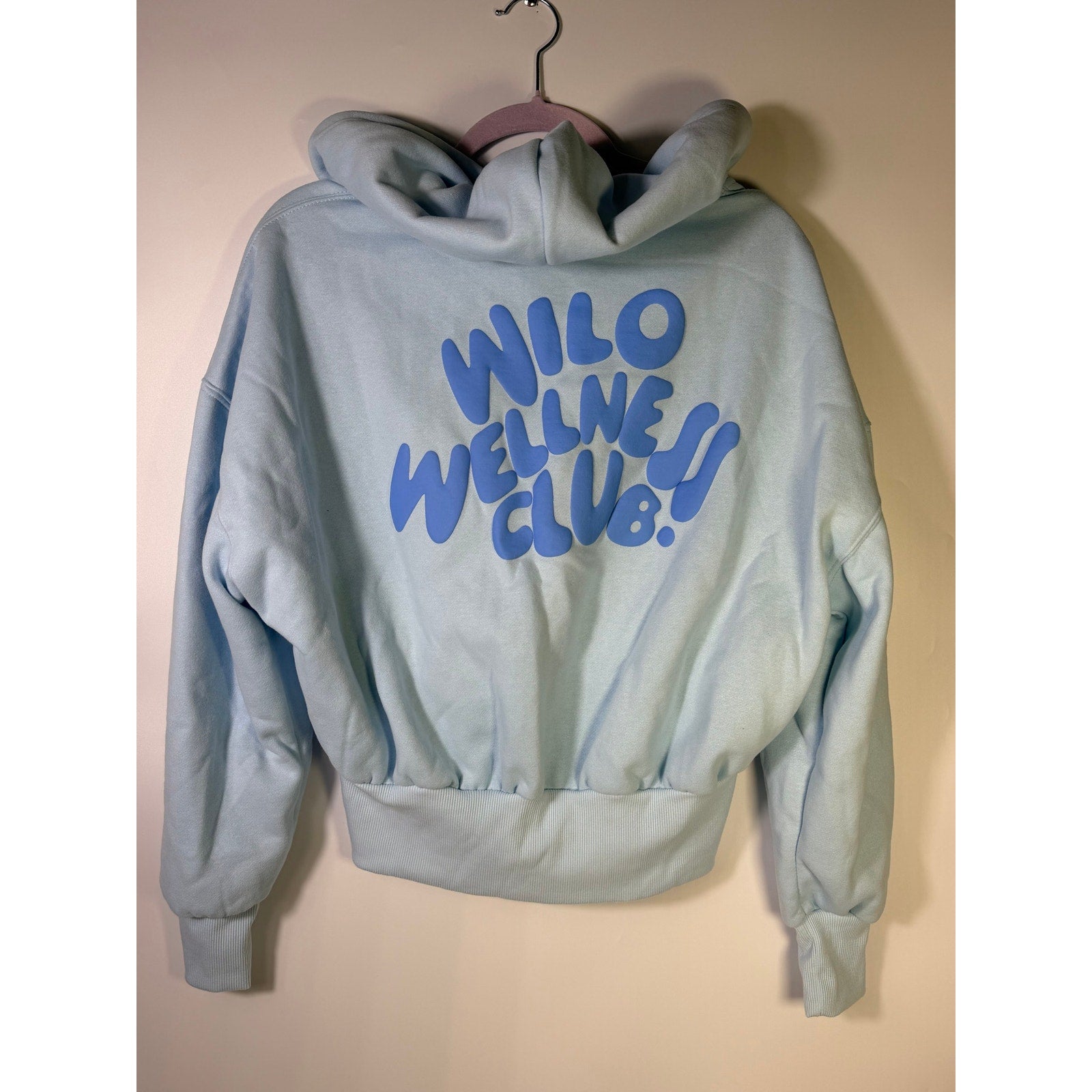 Wilo The Label Wellness Club blue women's crop zip hoodie, front view, size M, casual athletic style, soft fabric, with hood and zip closure.