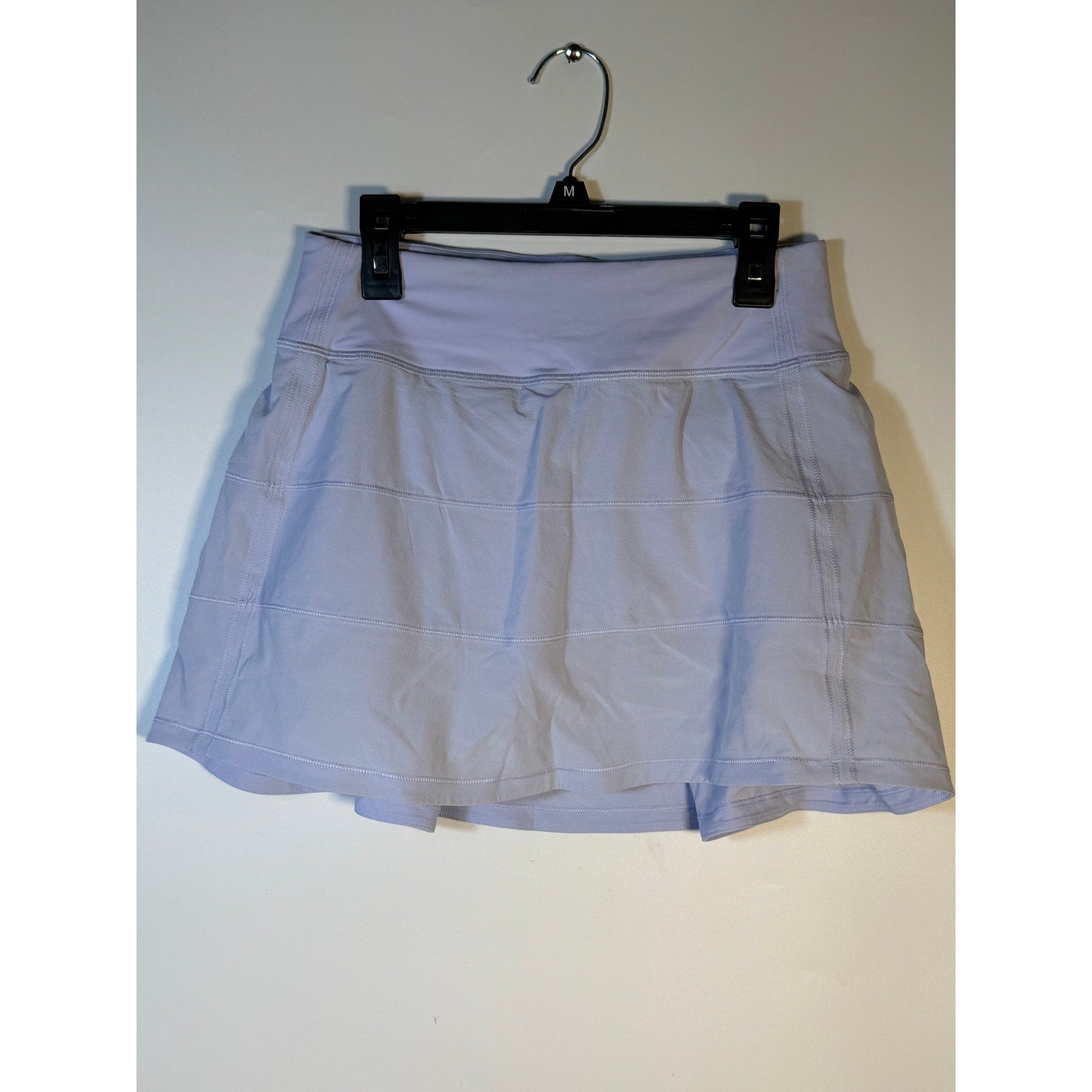 Light blue Lululemon women's tennis skort with athletic styling, size 2, featuring a fitted waistband and sporty design.