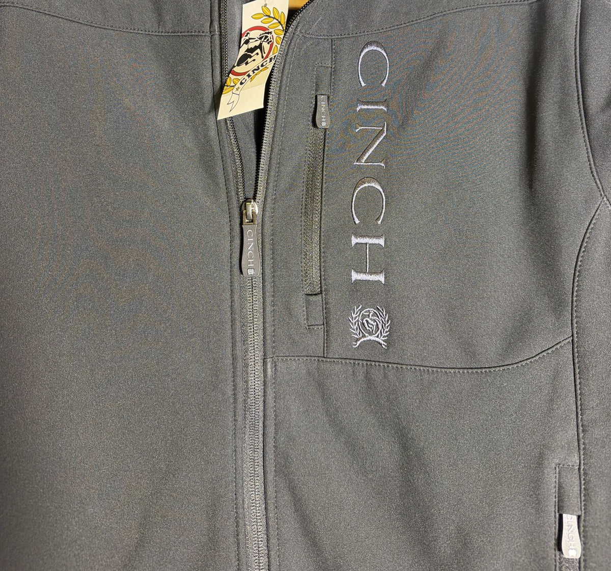 Men's black Cinch bonded softshell jacket with embroidered logo in size S, showing the jacket's front view and softshell material.