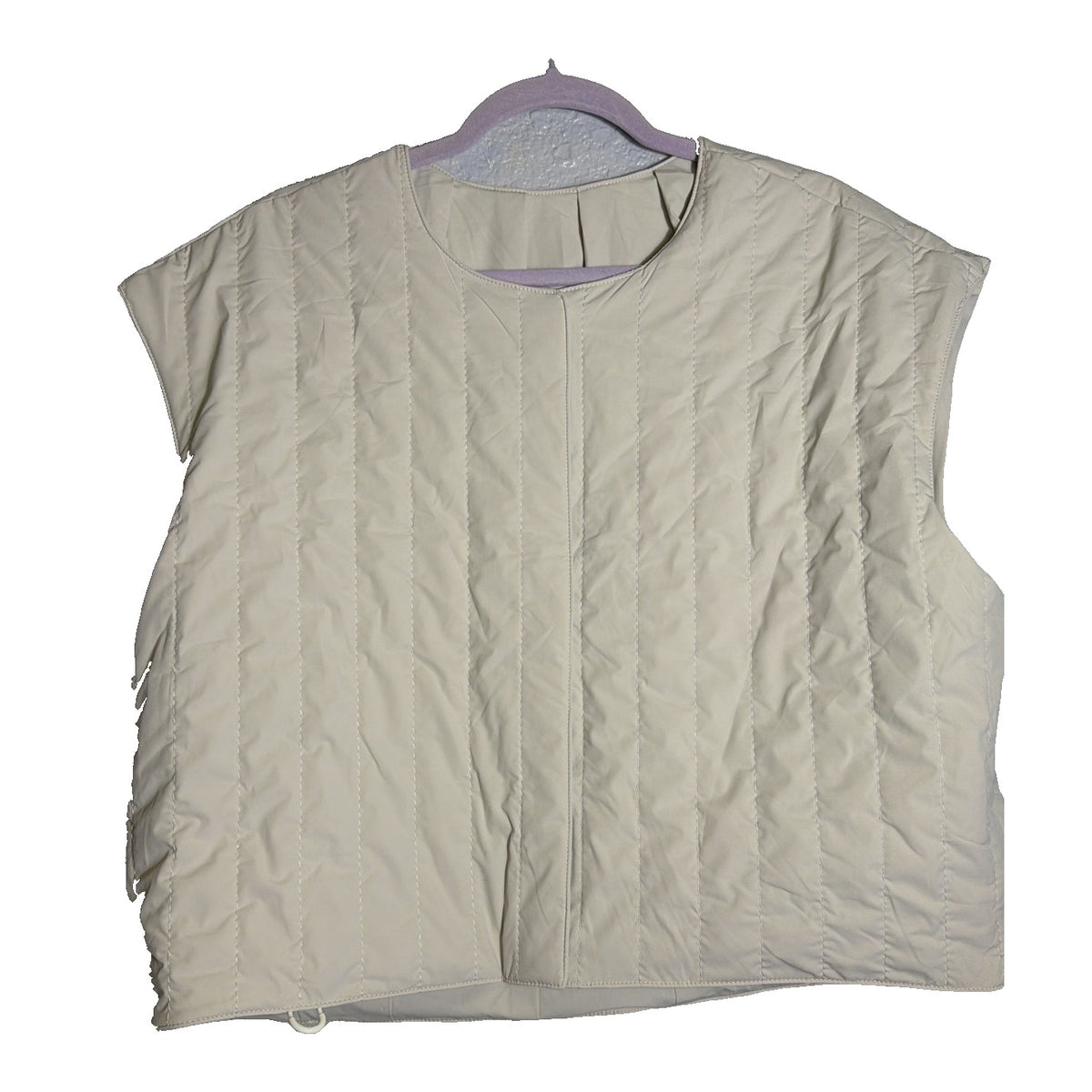 Nike 24.7 Reversible Quilted Puffer Vest for women, Sail and Cream color, front view showing quilted design and reversible style.