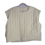 Nike 24.7 Reversible Quilted Puffer Vest for women, Sail and Cream color, front view showing quilted design and reversible style.