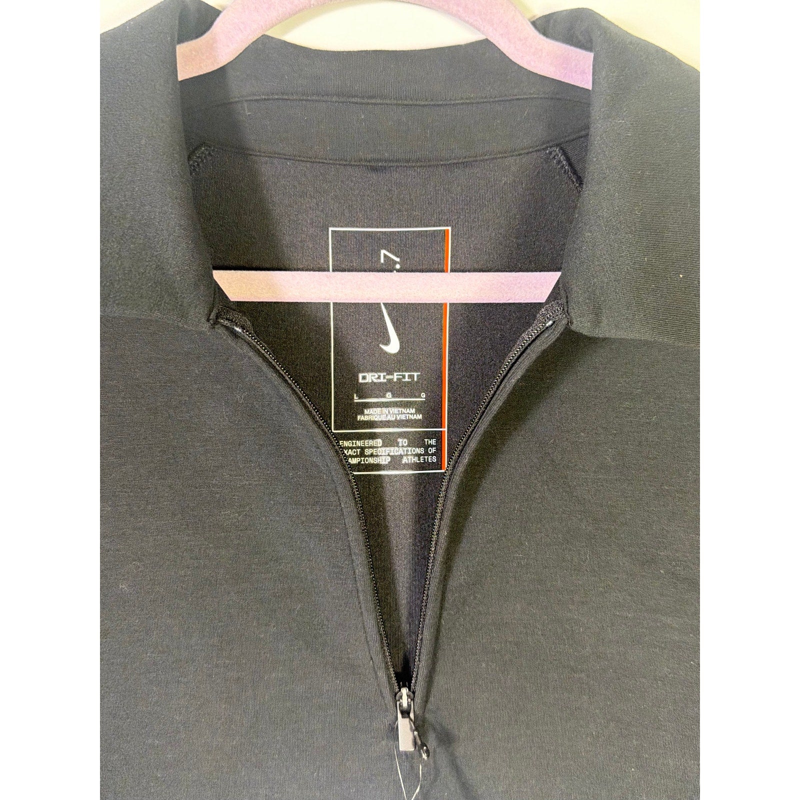 Nike Dri-FIT men's black 1/4 zip golf polo shirt, short sleeve, size large, new with tags, displayed on a plain background.