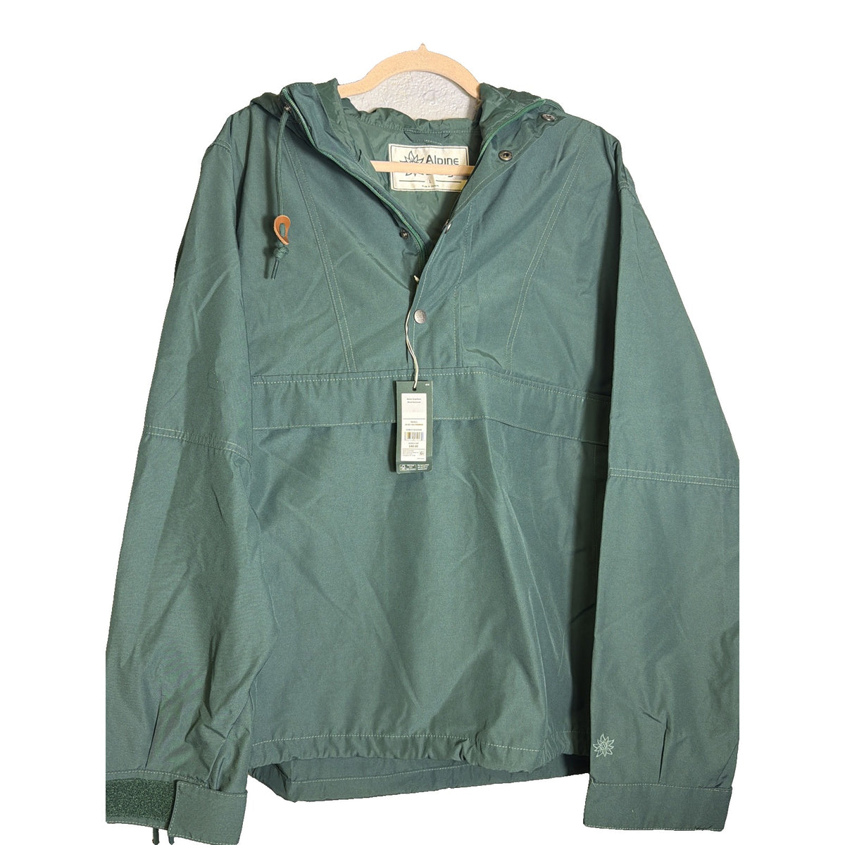 Men's Alpine Design 1962 Anorak pullover jacket in forest shadow green, hooded, size L, displayed on a hanger.