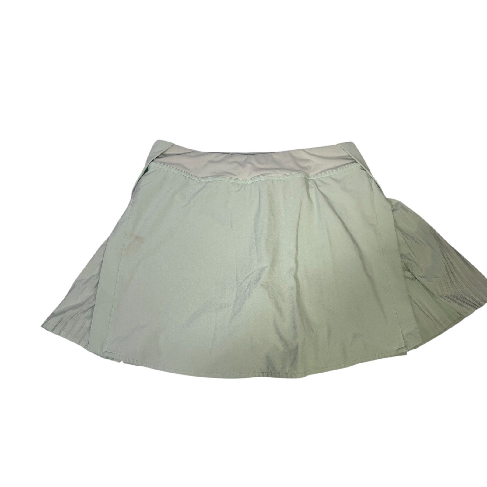 Lululemon women's light mint pleated tennis skort with built-in shorts, size 6, showing front view of the athletic skort.