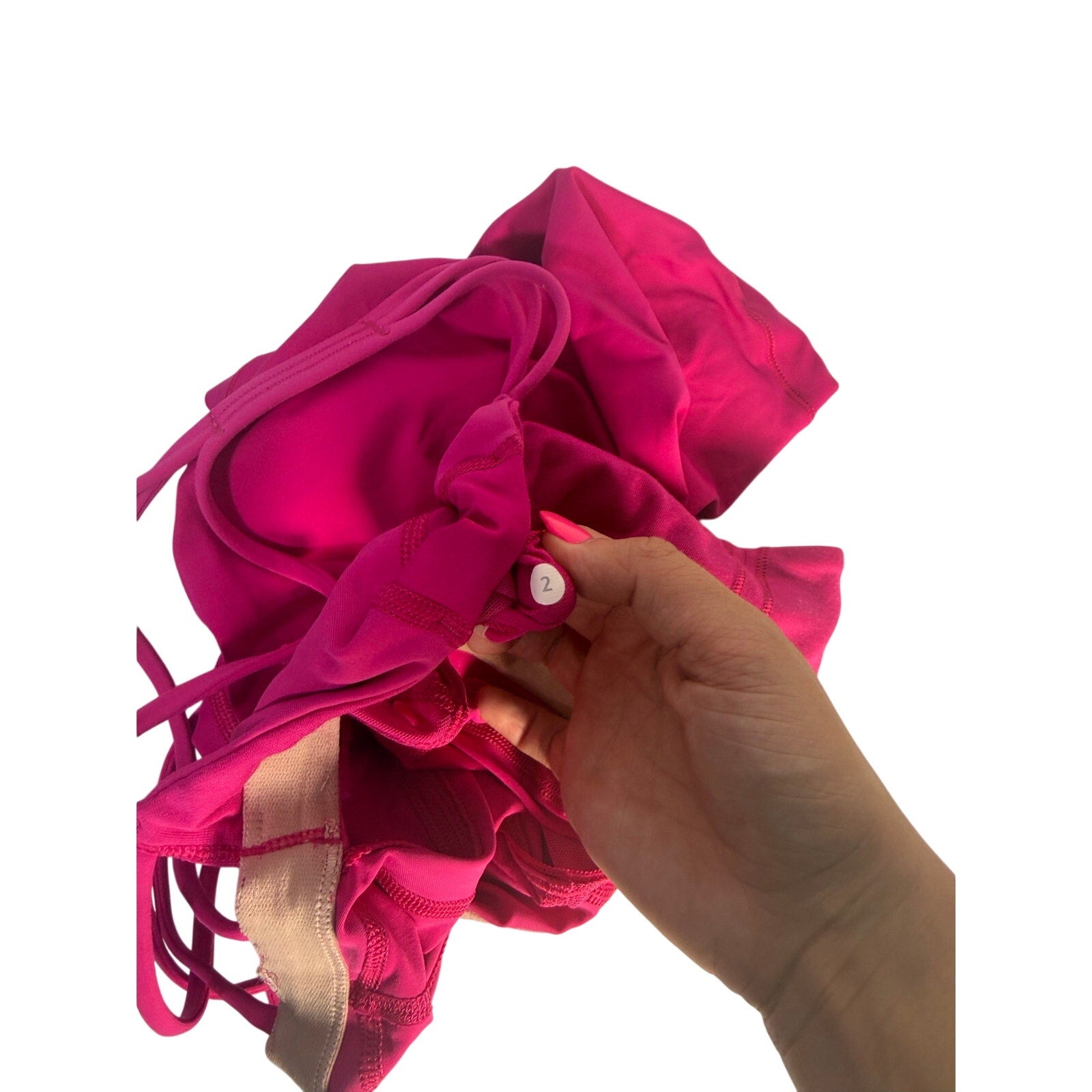 Lululemon women's magenta strappy cutout athletic tank top, size 2, pre-owned, shown on a hanger.