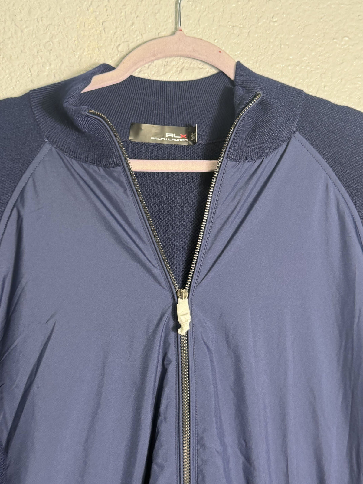 Navy Ralph Lauren RLX hybrid full-zip knit sweater jacket for men, size XL, shown on a hanger with a stand-up collar.
