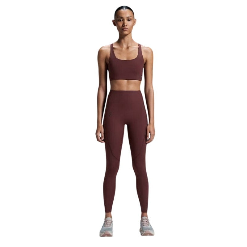 On Running Women's Small Movement Tights in Mulberry, long leggings with a snug fit, stretchy fabric, and comfortable waistband.