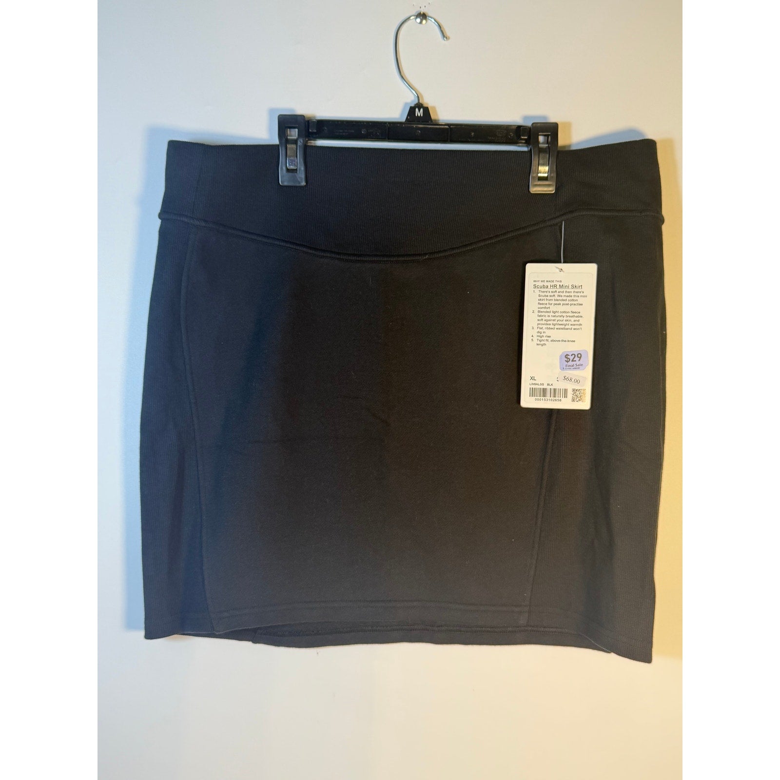 Black Lululemon Scuba HR Mini Skirt for women, featuring fleece fabric, above knee length, suitable for athletic and casual wear.