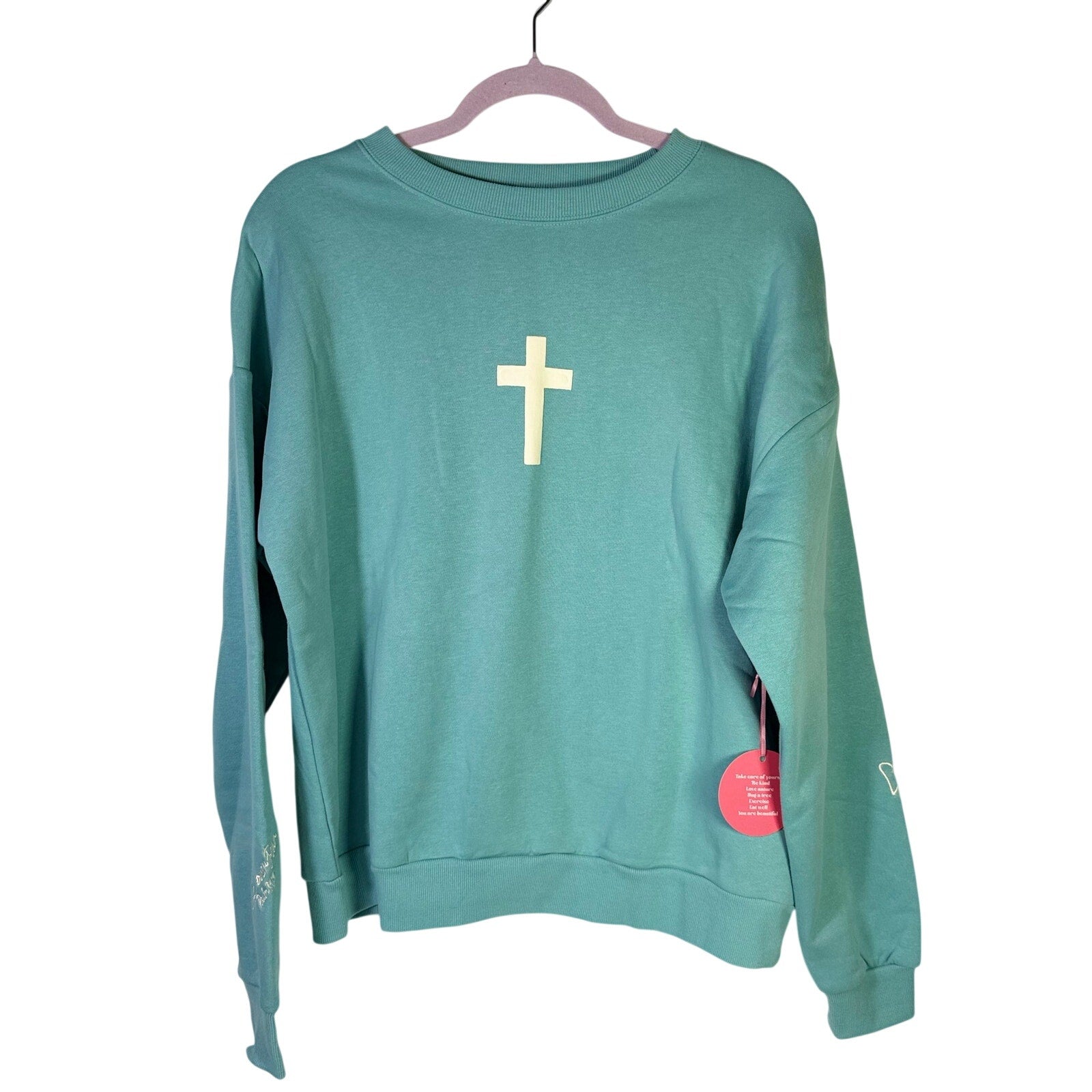 Green Seventh & Sunset Faith Over Fear Christian crewneck sweatshirt, medium size, featuring printed text and comfortable fabric.