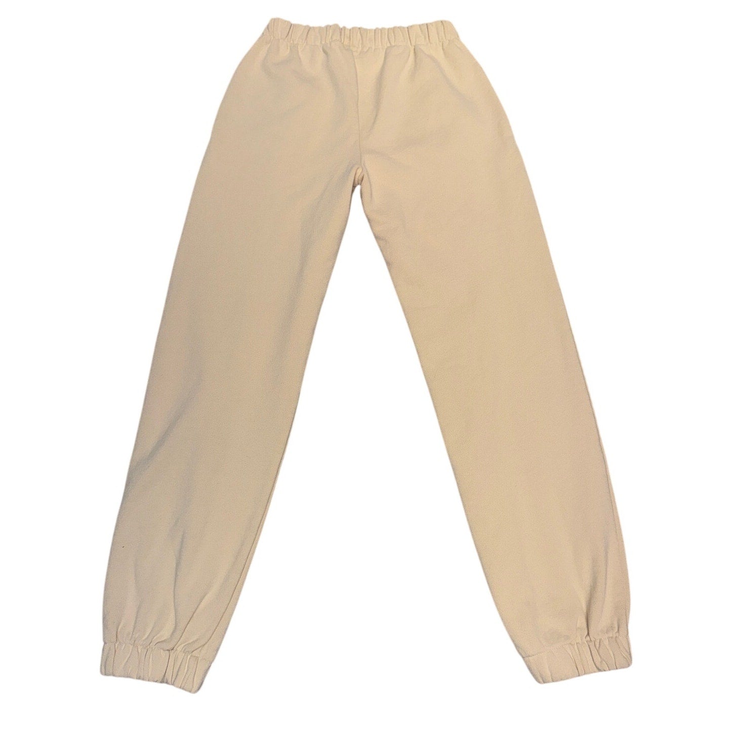 Cream beige Brandy Melville New York graphic jogger sweatpants with elastic waist, size L, casual and comfortable fit.