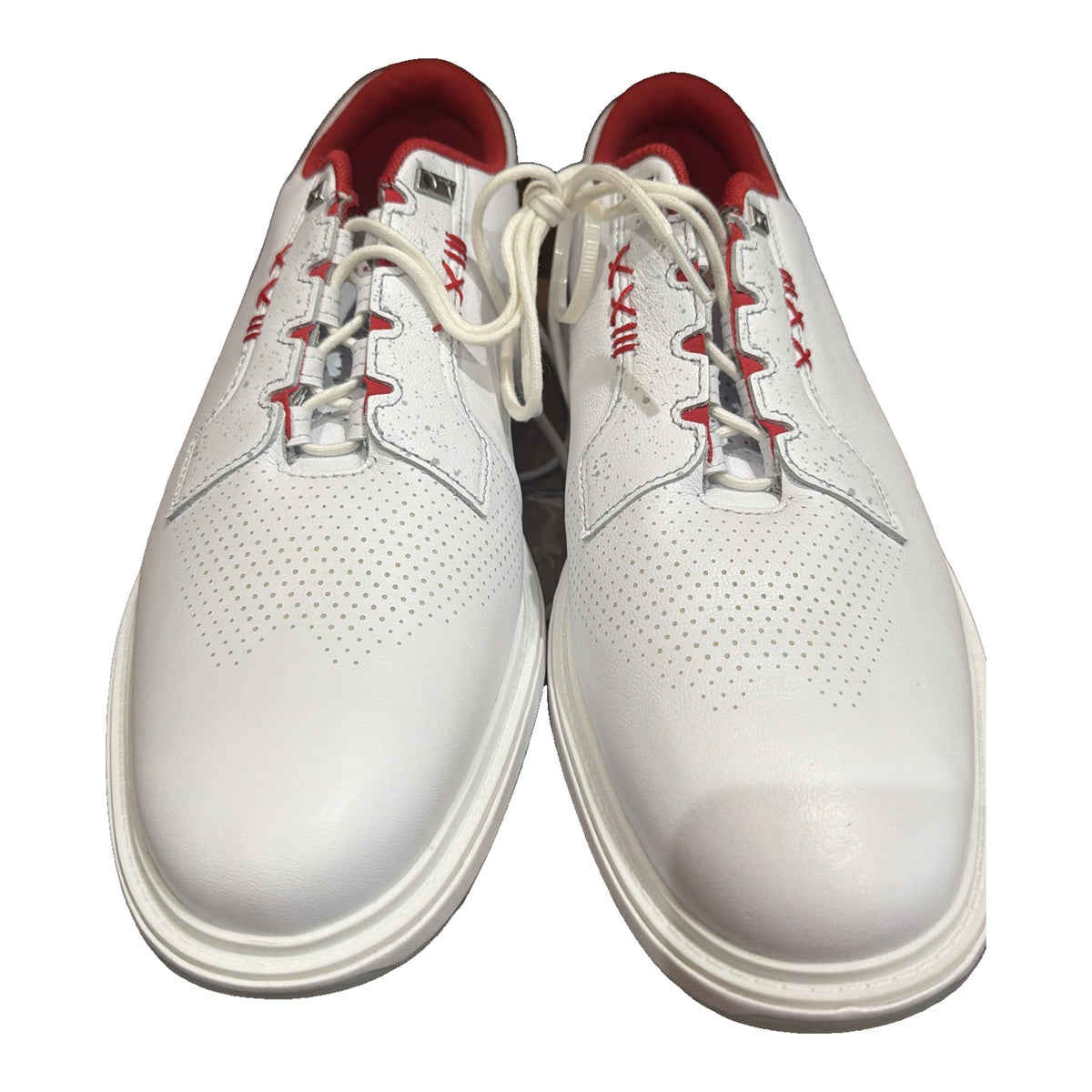 Men's Nike Jordan ADG 4 golf shoes in white and gym red, featuring breathable upper and sporty design.