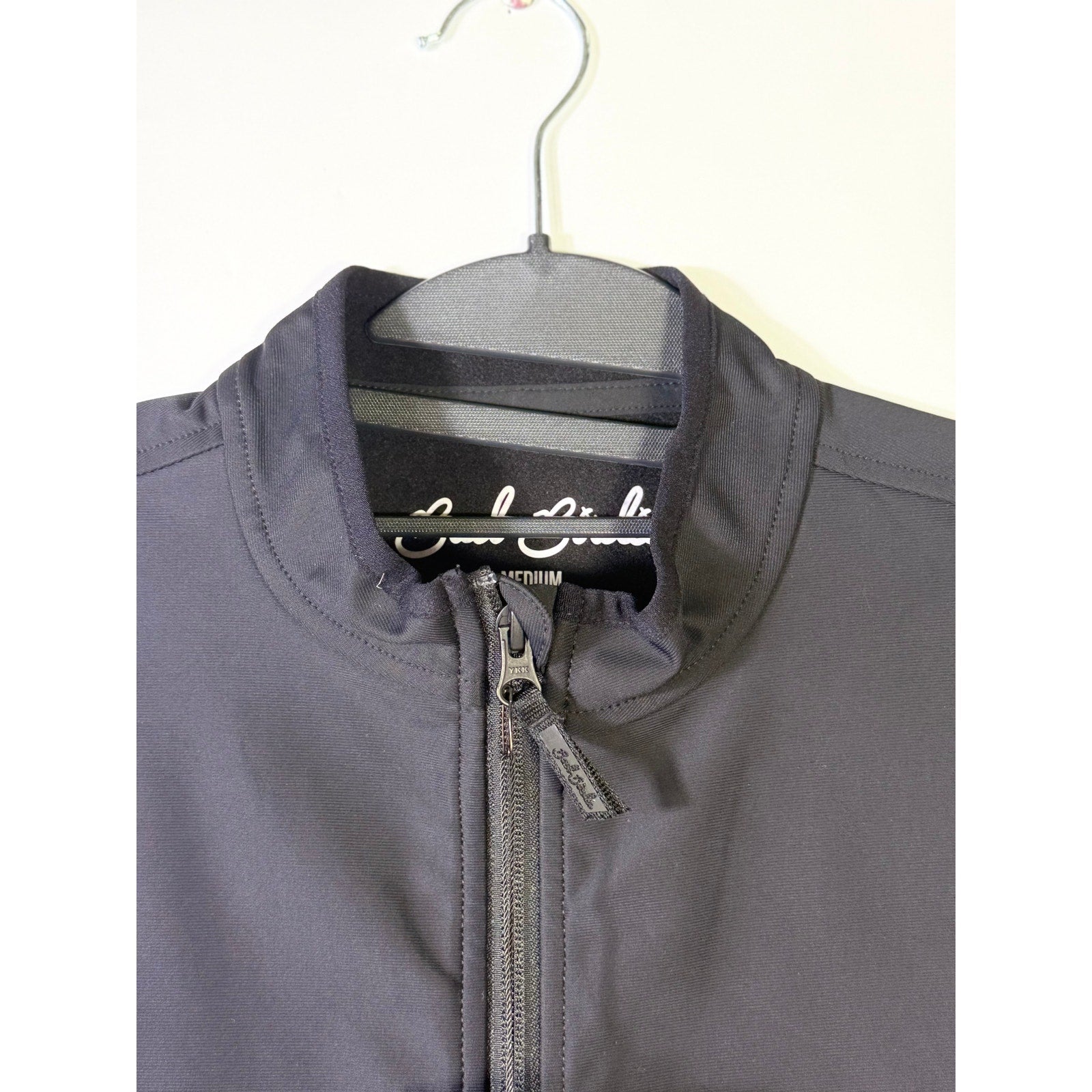 Black Bad Birdie men's softshell golf vest with full zip, size medium, lightweight and stylish for outdoor golf activities.