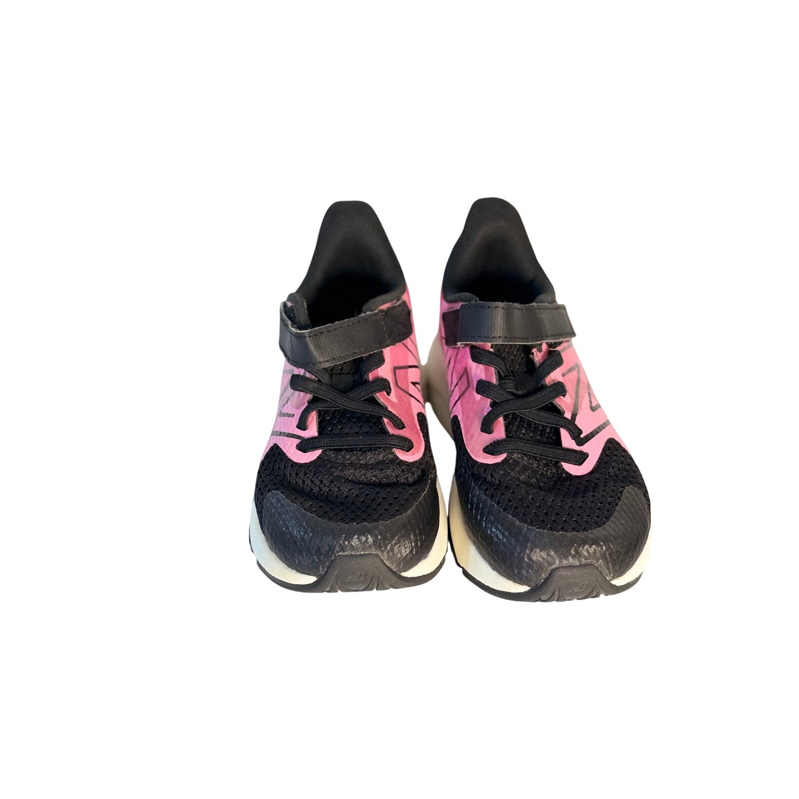 New Balance kids' black and pink athletic running shoes with hook and loop straps, size 11 US, for active children.