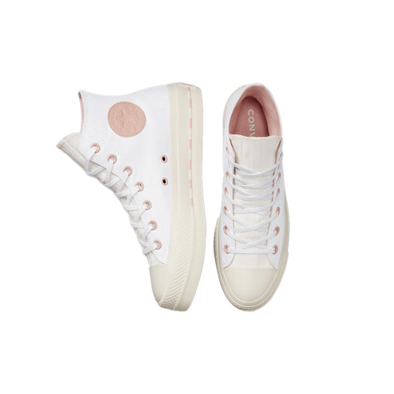 Converse Chuck Taylor All Star Lift High sneakers in white with pink clay accents, women's size 7.5, showing side view of the shoes