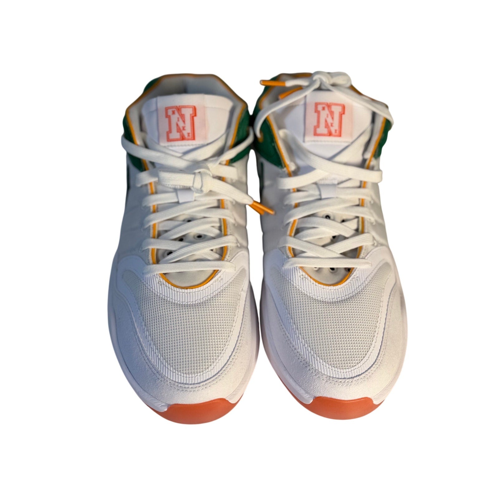Nike men's athletic sneakers in white with green and orange accents, size 10.5, casual Nike sneakers with breathable design.