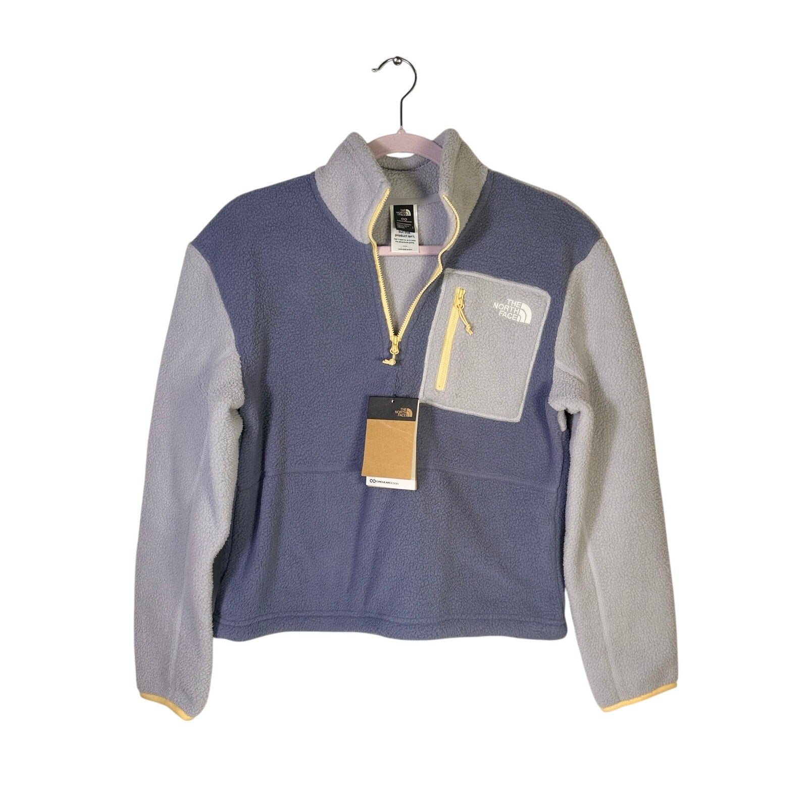 The North Face women’s Twilight Galaxy Yumiori 1/4 zip fleece pullover in size S, shown laid flat with front view.