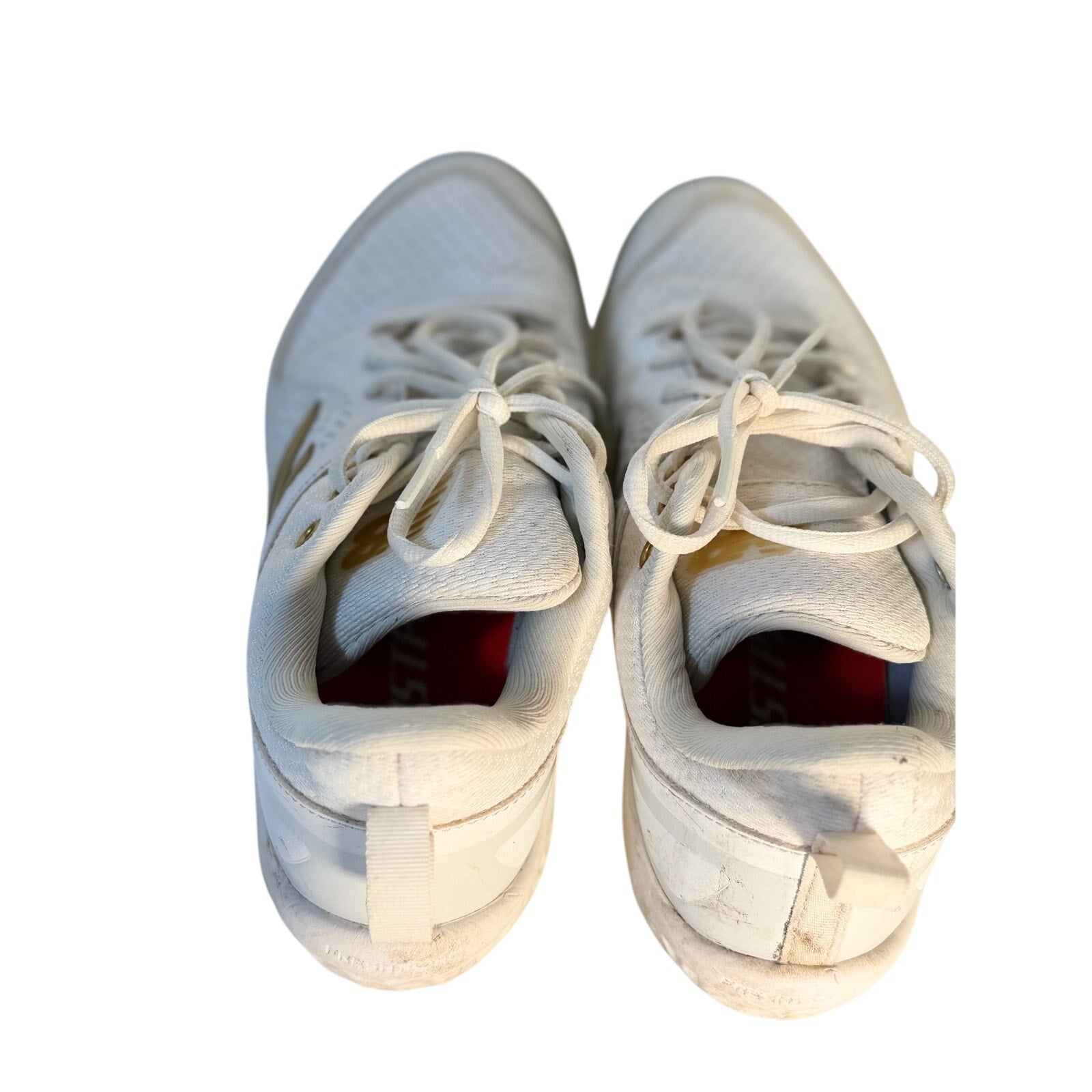 New Balance FuelCell COMPv2 baseball cleats in white and gold, men's size 7.5, with metal cleats and athletic shoe design.