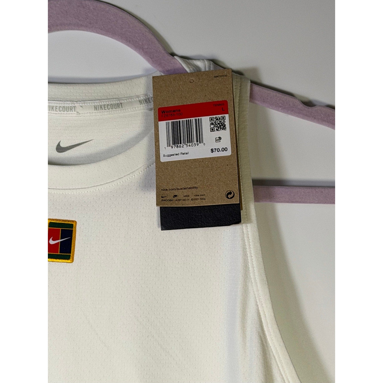NikeCourt women's white Dri-FIT tennis tank top, size large, with sleeveless design and athletic fit for active play.
