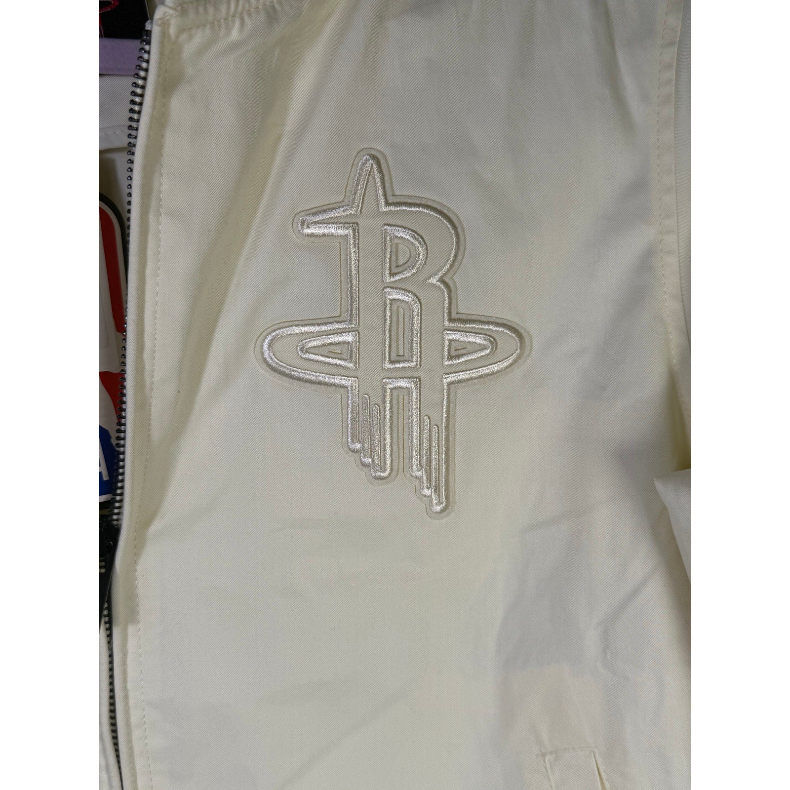 Pro Standard women’s Houston Rockets cream bomber jacket, size S, showcasing the jacket's design and branding details.