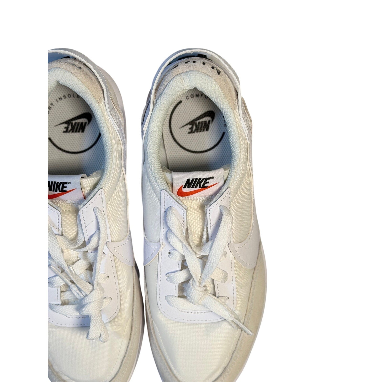 Nike Waffle Debut women's sneakers in size 9.5 with classic design and white and beige colorway, showcasing the comfortable athletic shoe.