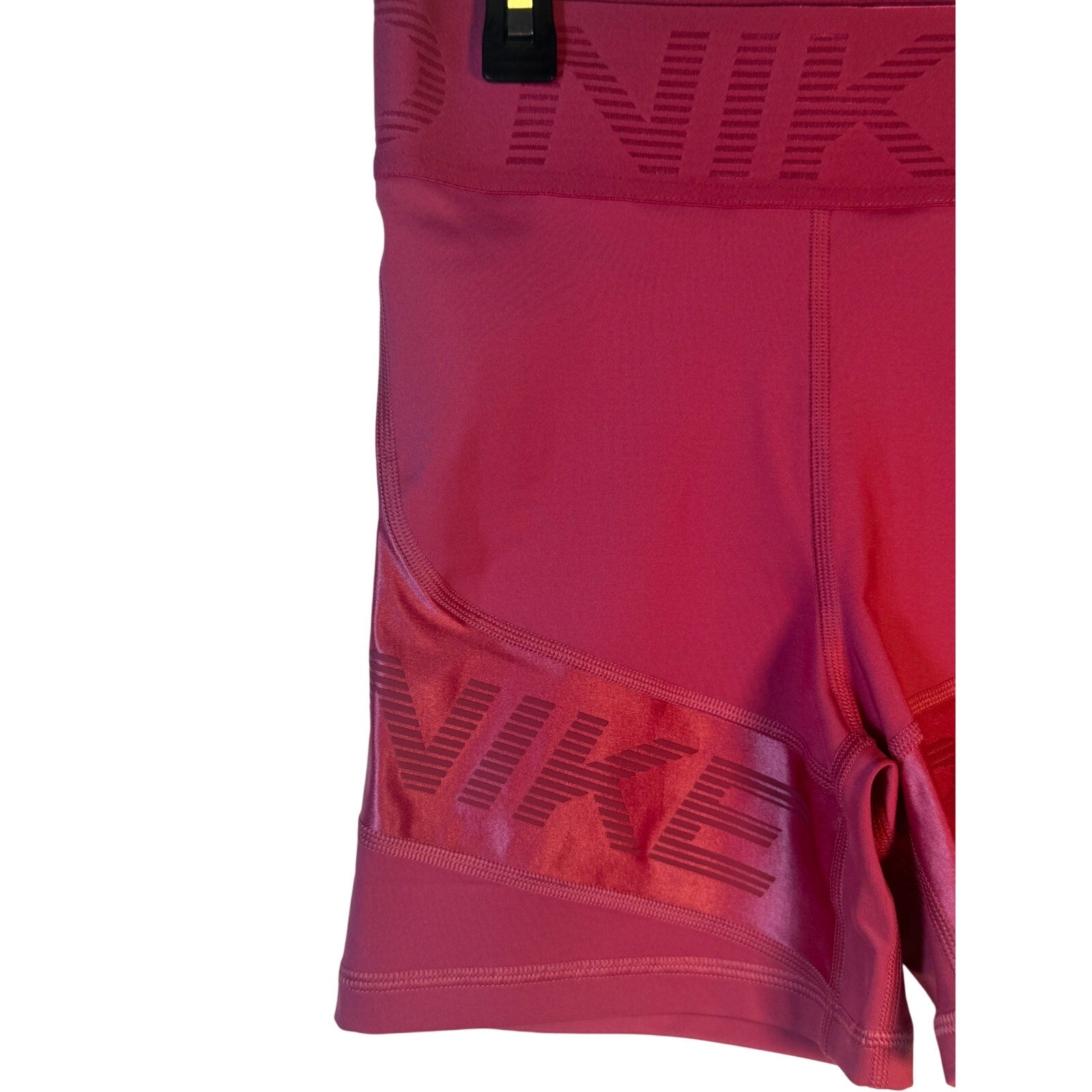 Nike Pro high-rise training shorts for women in small size, featuring a firm support fit and berry color.