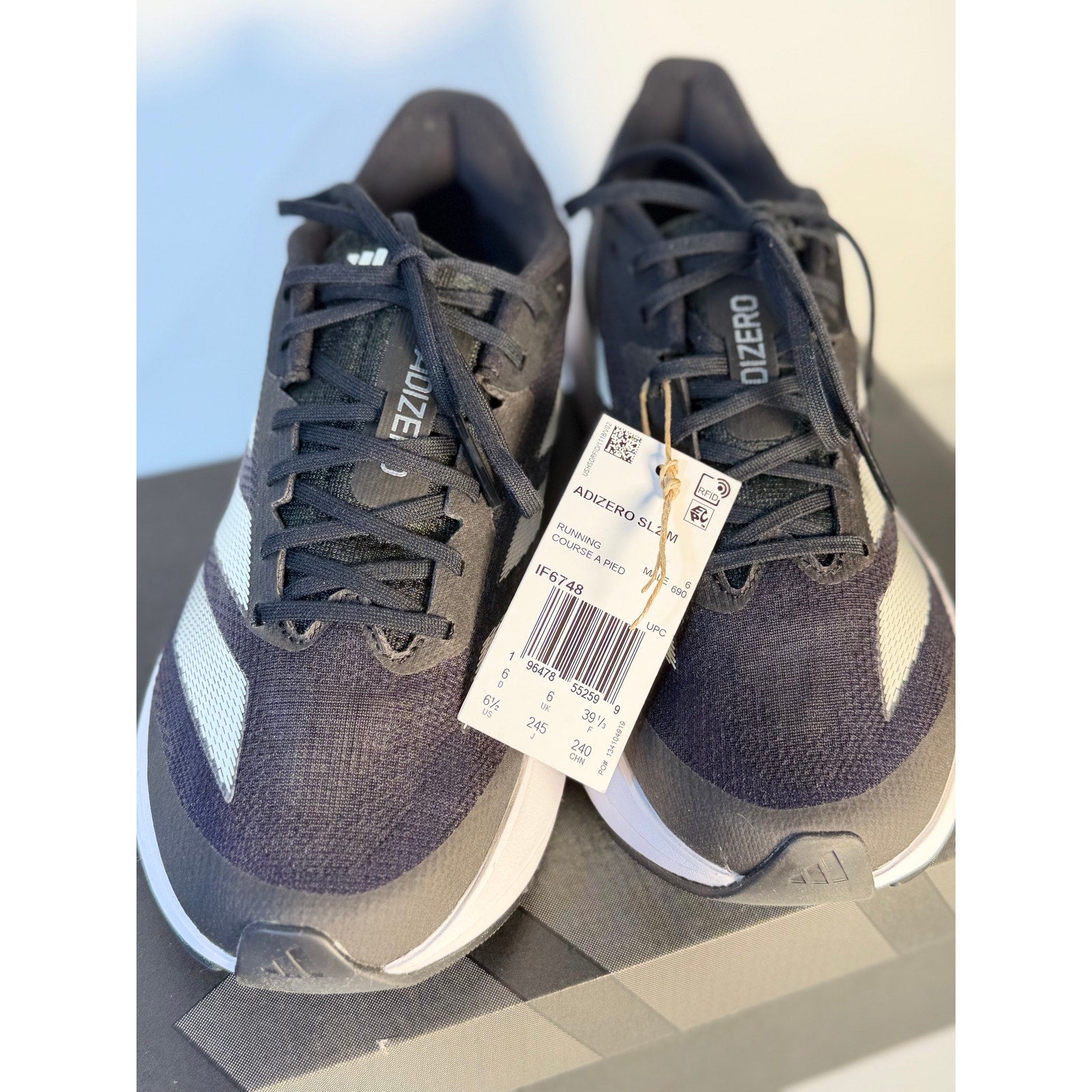 Men's Adidas Adizero SL2 athletic running shoes in black and white with lightstrike sole, size 6.5, new condition.