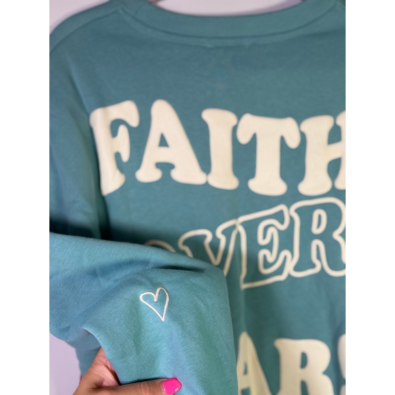 Seventh & Sunset Faith Over Fear Christian crewneck sweatshirt in green, medium size, with printed design and soft fabric.
