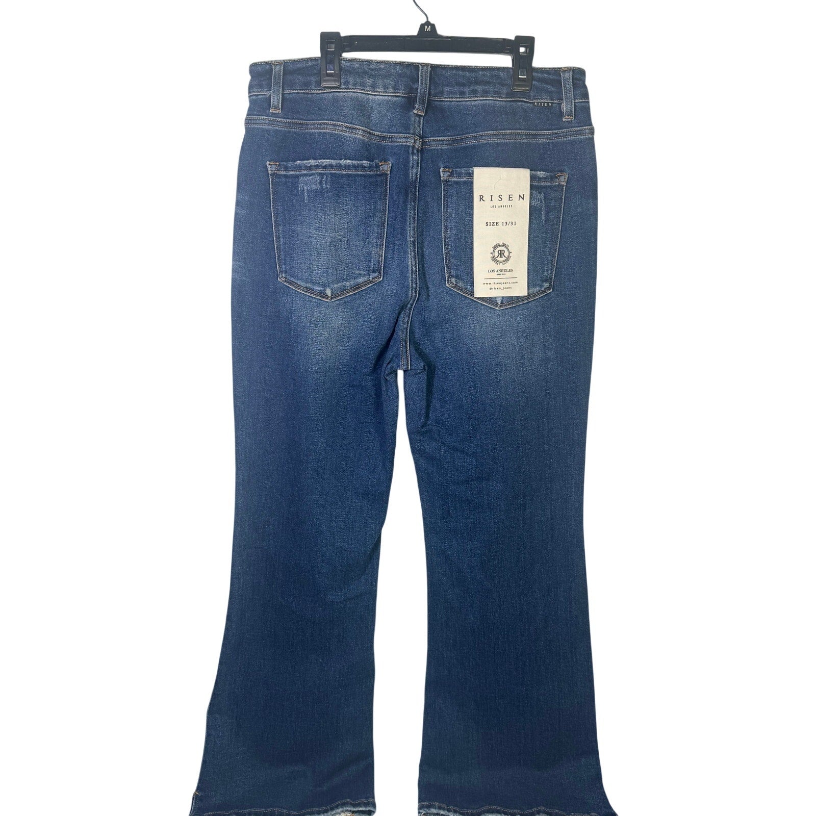 Risen Jeans women's size 13/31 dark wash distressed flare jeans, showing front view with frayed details and fitted silhouette.