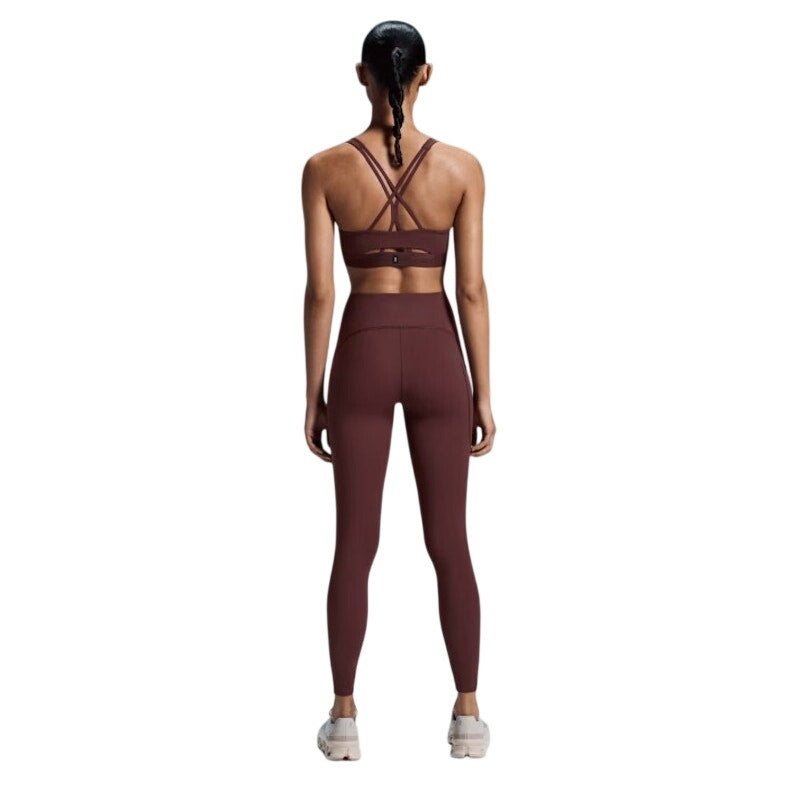 OnRunning women's small movement tights leggings in mulberry color with a close-up view of the fabric and waistband.