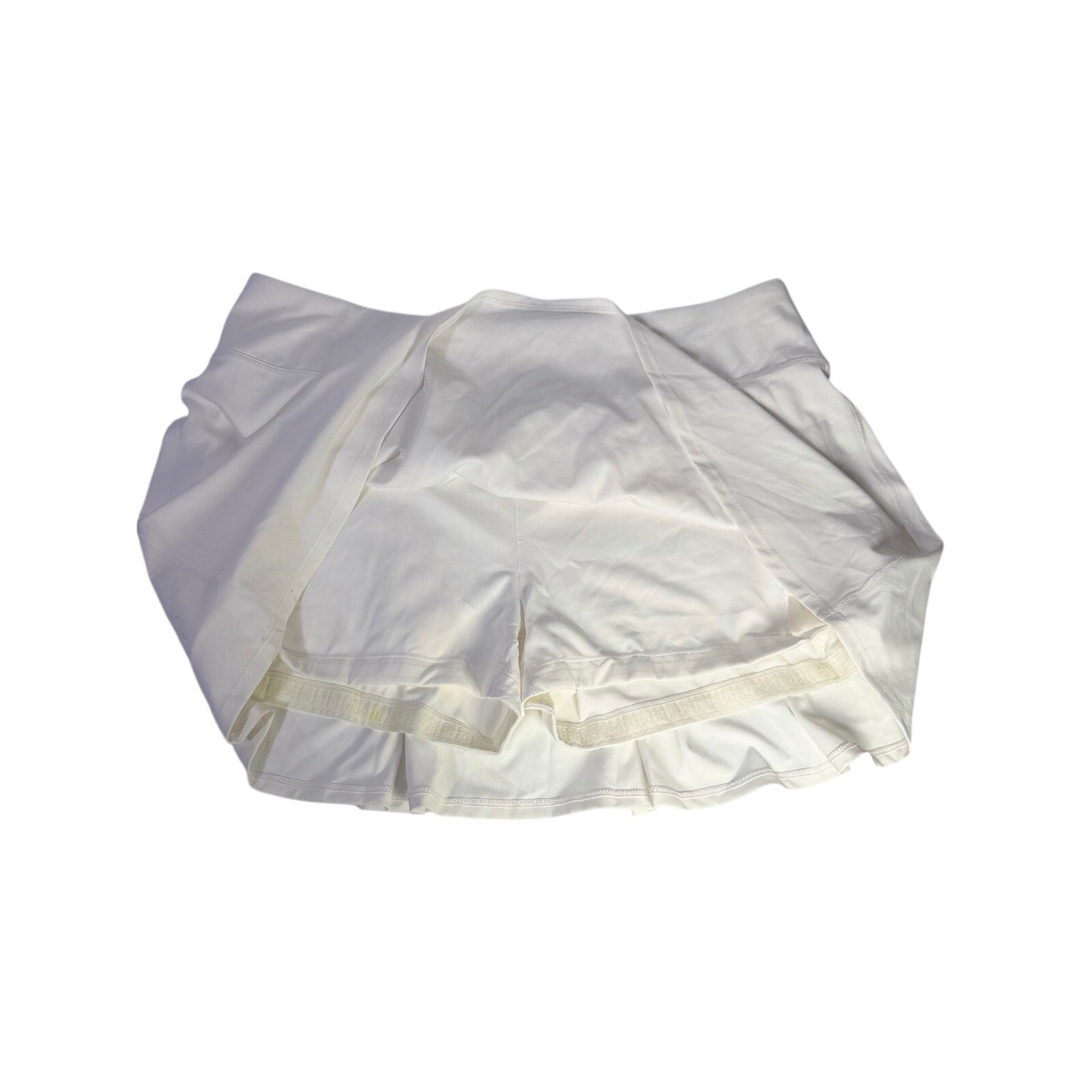 White CALIA women’s high-rise court collection skort, 14-inch length, size XL, with a fitted waistband and athletic design.