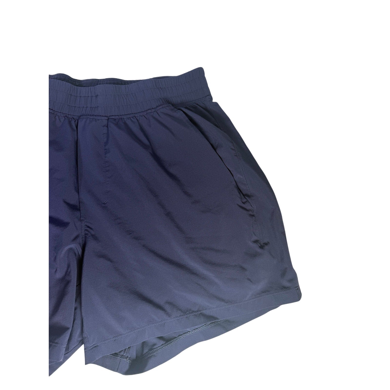 Lululemon men's navy blue athletic running shorts, size M, with lightweight fabric and elastic waistband, suitable for running and workouts.