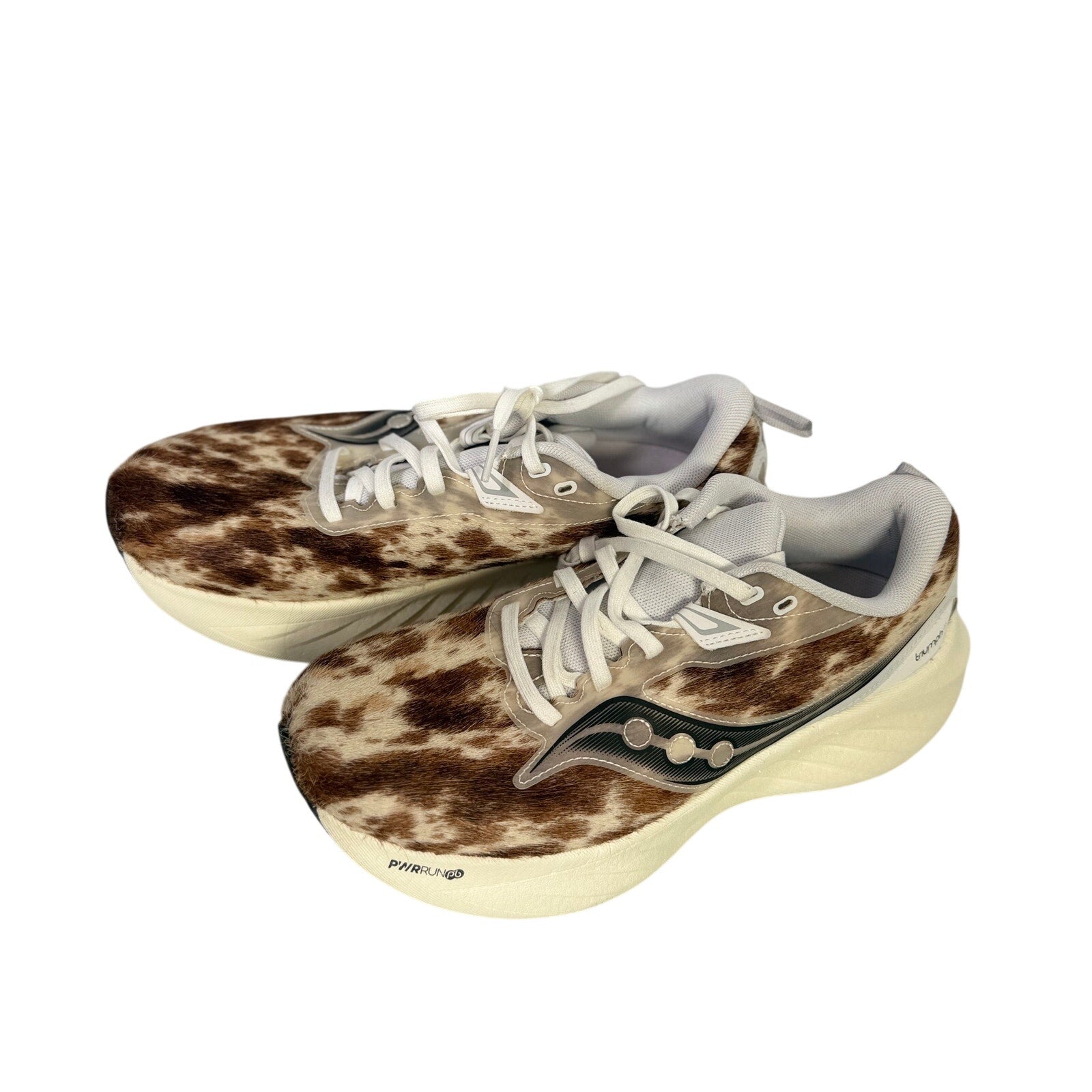 Saucony Women’s Endorphin Shift 3 Runshield cow print athletic running shoes, size 9, with black and white design and cushioning.