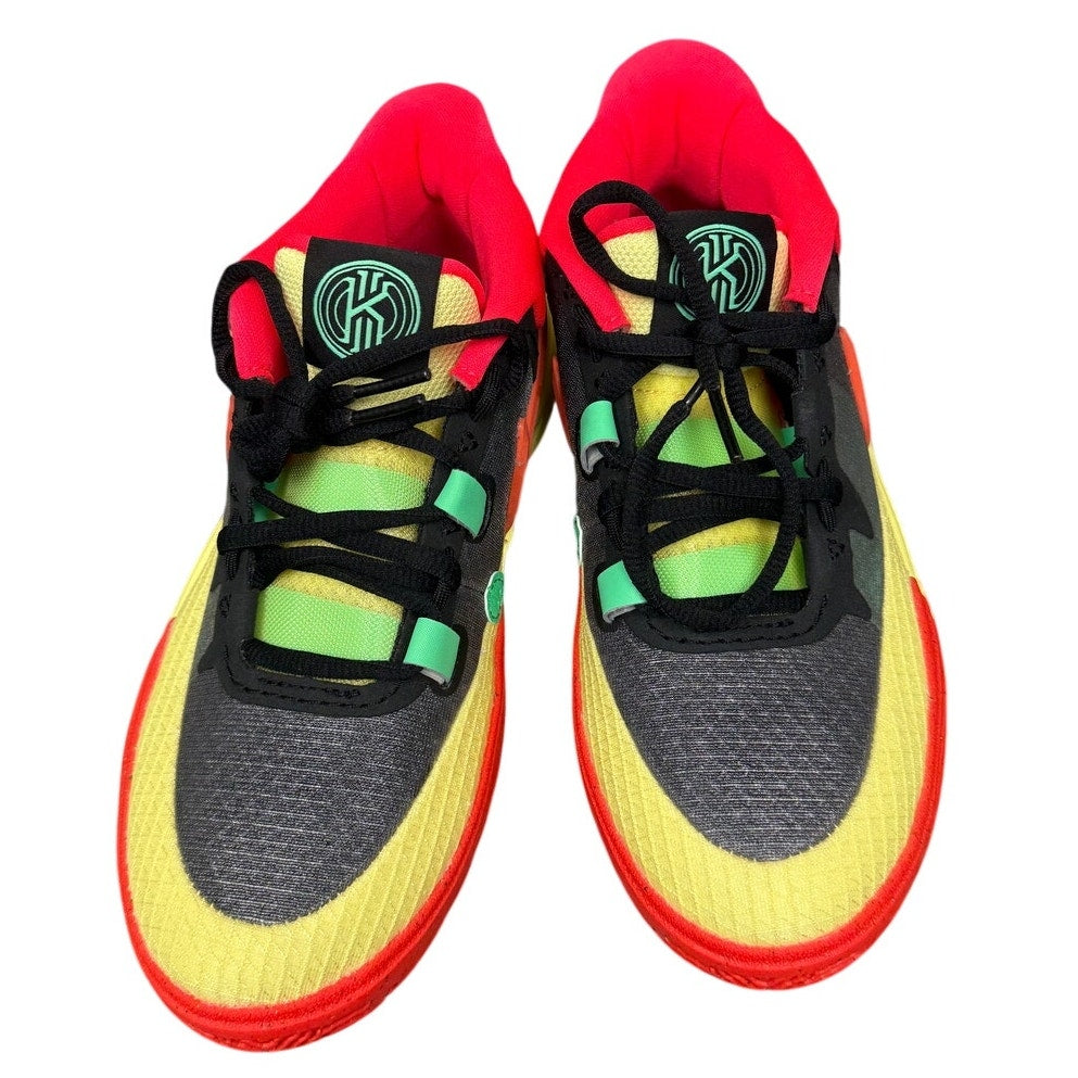 Nike Kyrie 8 GO basketball shoes for grade school in black and lemon chiffon, featuring a sleek design and sporty style.