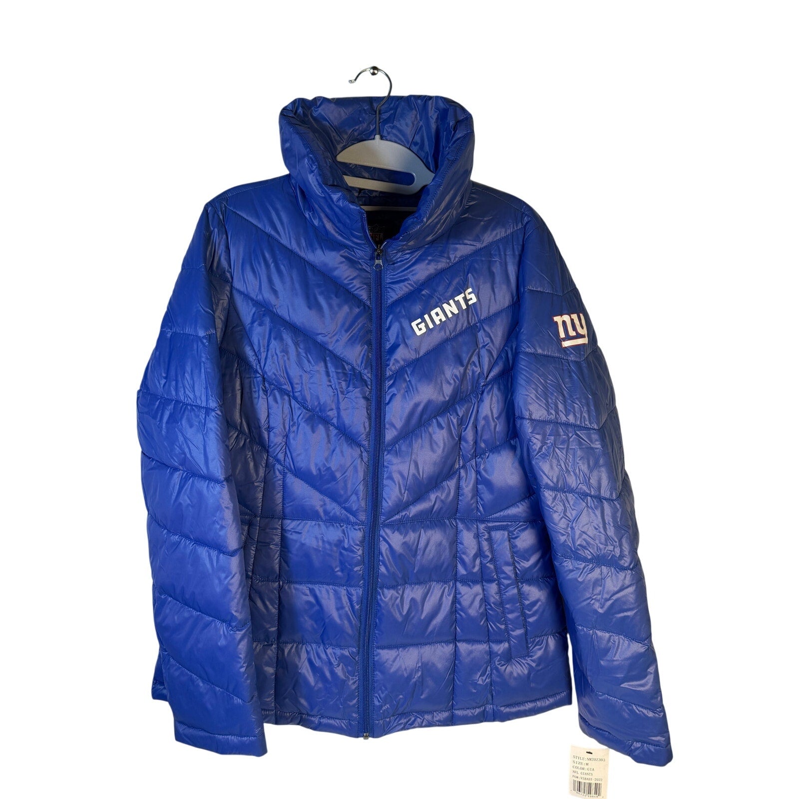 Women’s NFL New York Giants blue puffer jacket, medium size, full zip, insulated winter coat with team logo detail.