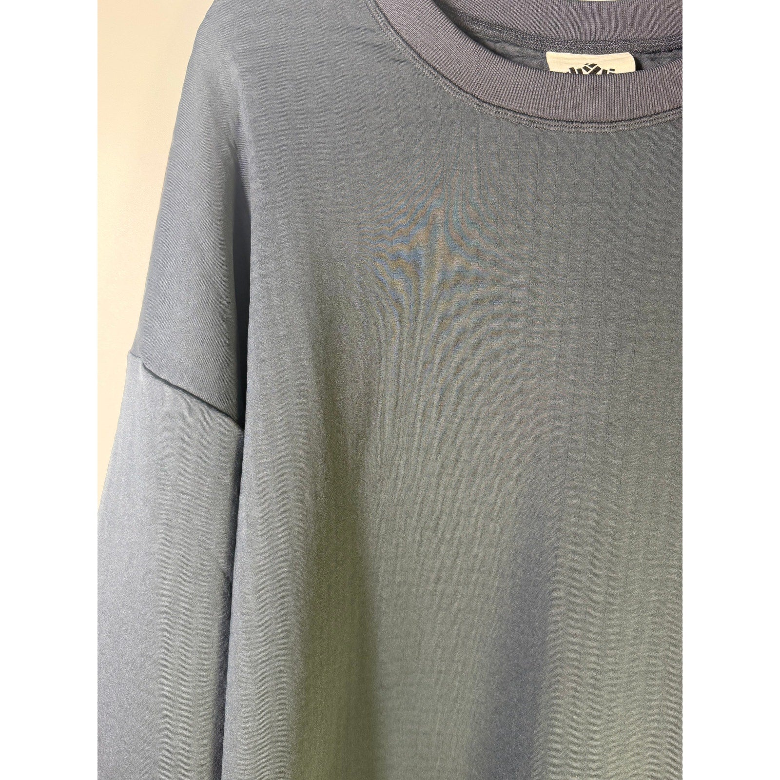 Women's Obermeyer Explorer Tech Crew Pullover Sweatshirt in blue nights, showing the crew neckline and soft fabric texture.