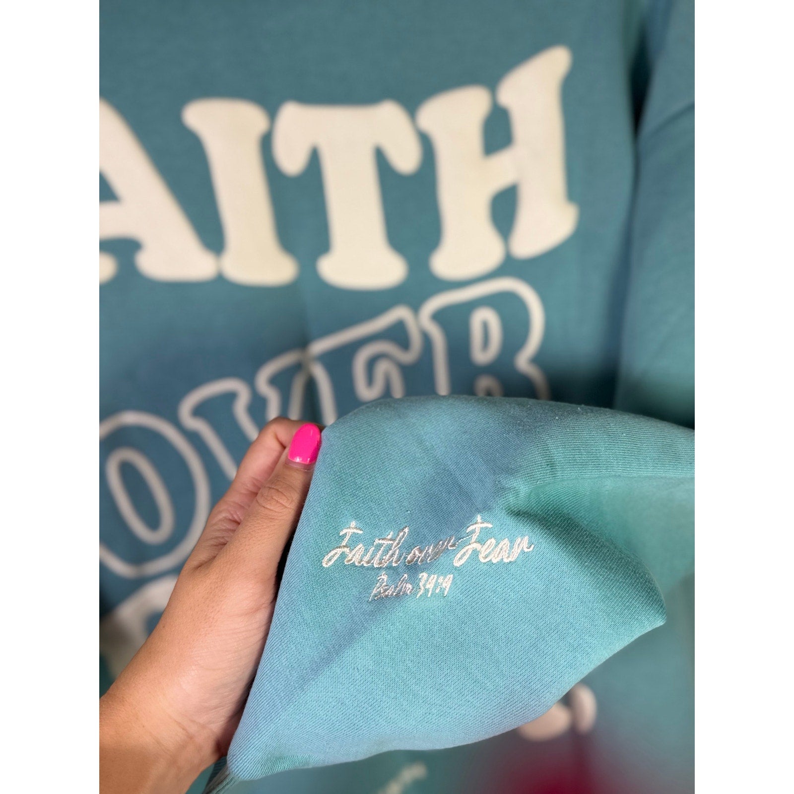 Green Seventh & Sunset Faith Over Fear Christian crewneck sweatshirt displayed flat with visible neckline and printed design.