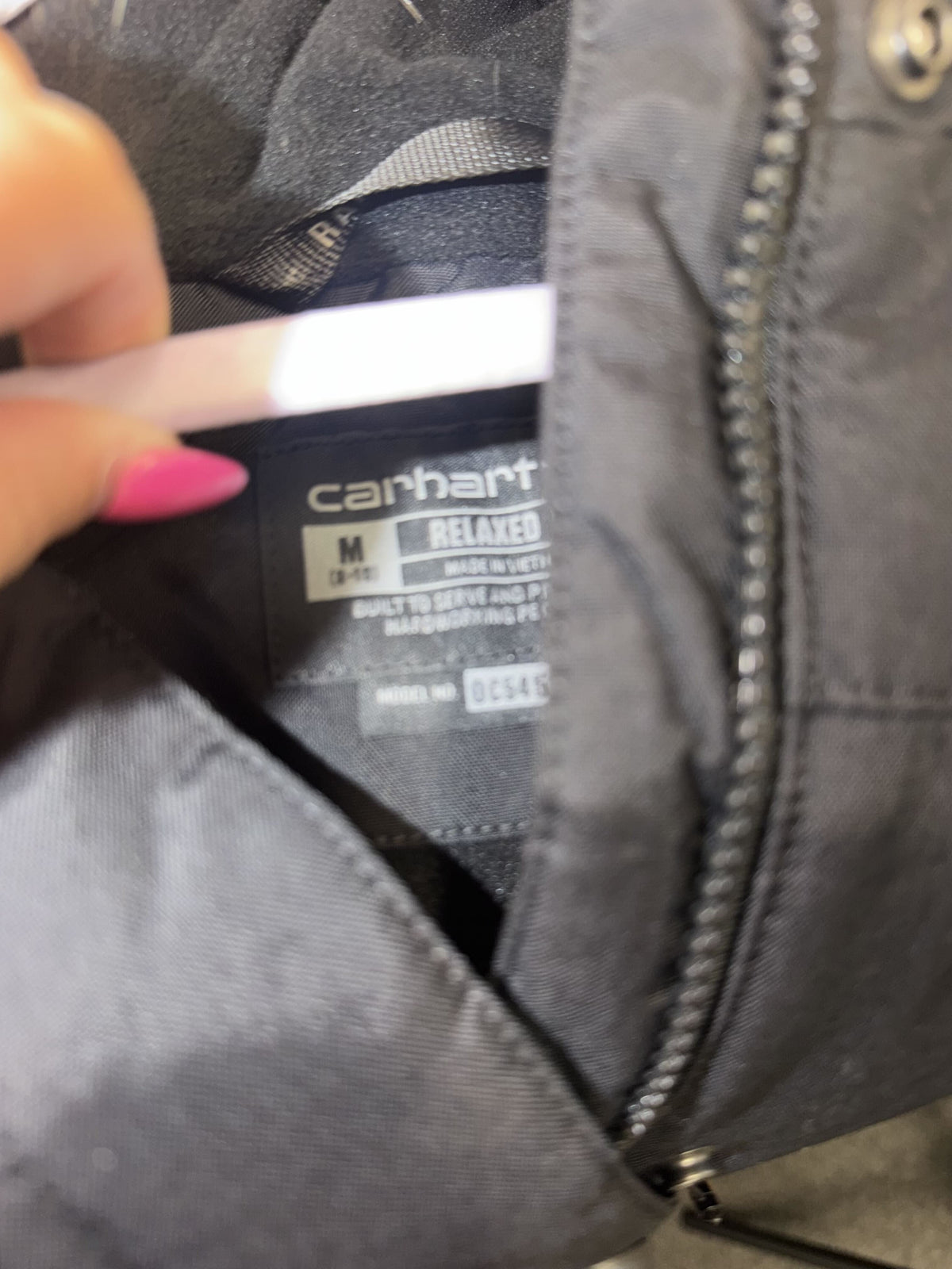 Carhartt Montana women's insulated parka jacket in black with faux fur hood, relaxed fit, medium size, front view