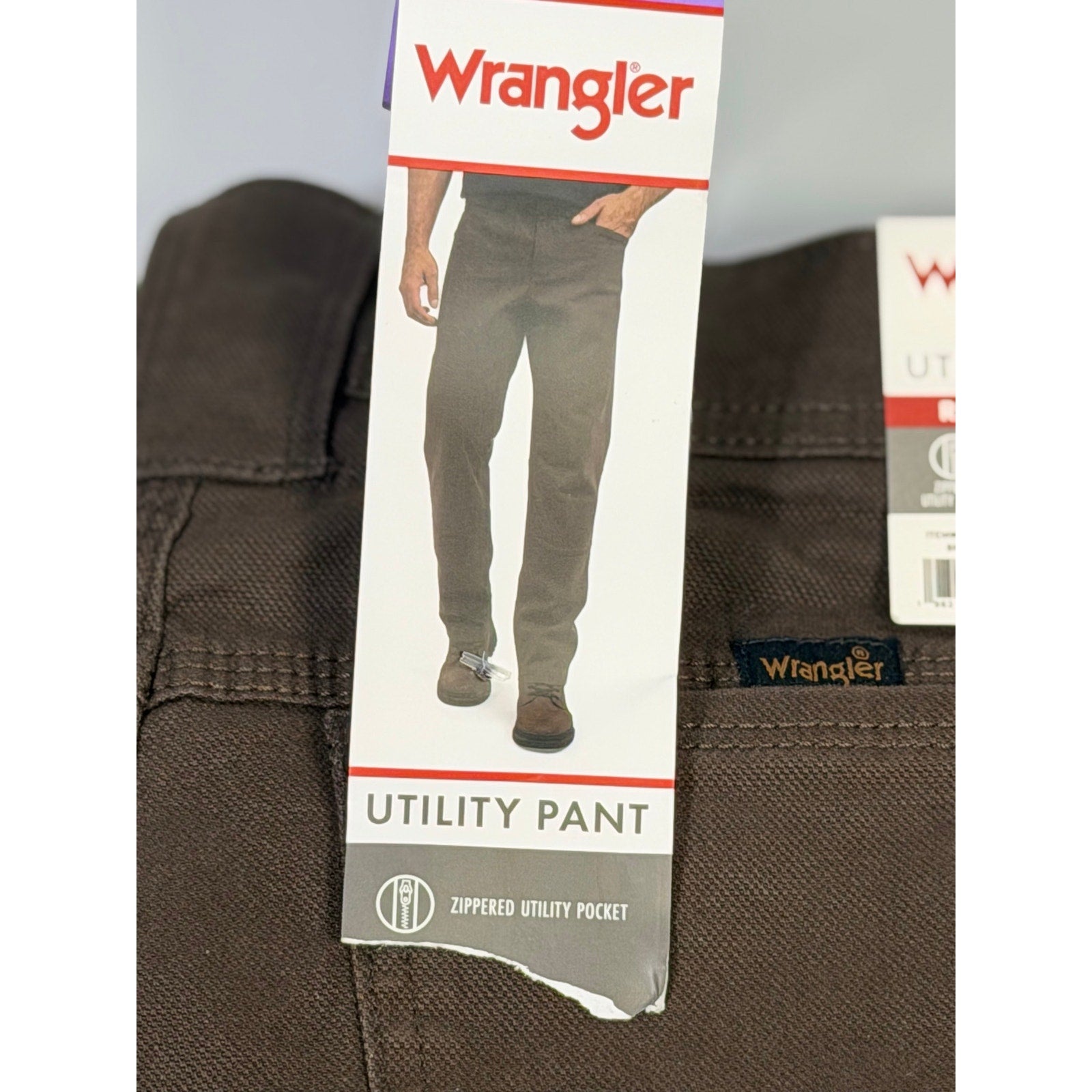 Wrangler men's brown utility work jeans, size 30x32, showing front view with multiple pockets and durable fabric.