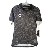 Men's black Charly Mexico Heritage SS soccer jersey with Aztec print, size XS, featuring short sleeves and athletic fit.