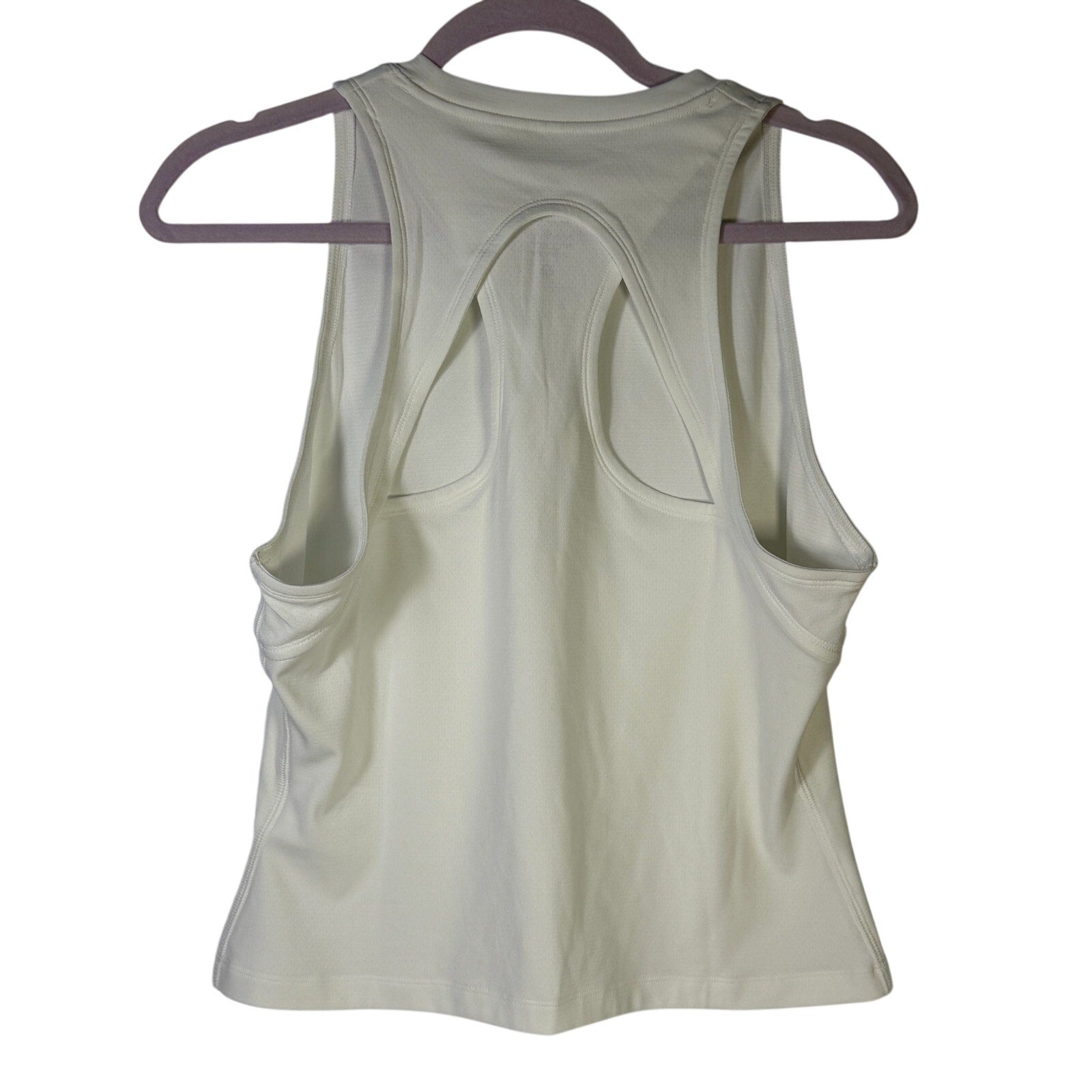 NikeCourt women's white tennis tank top in size XL, lightweight sleeveless athletic top with breathable fabric.