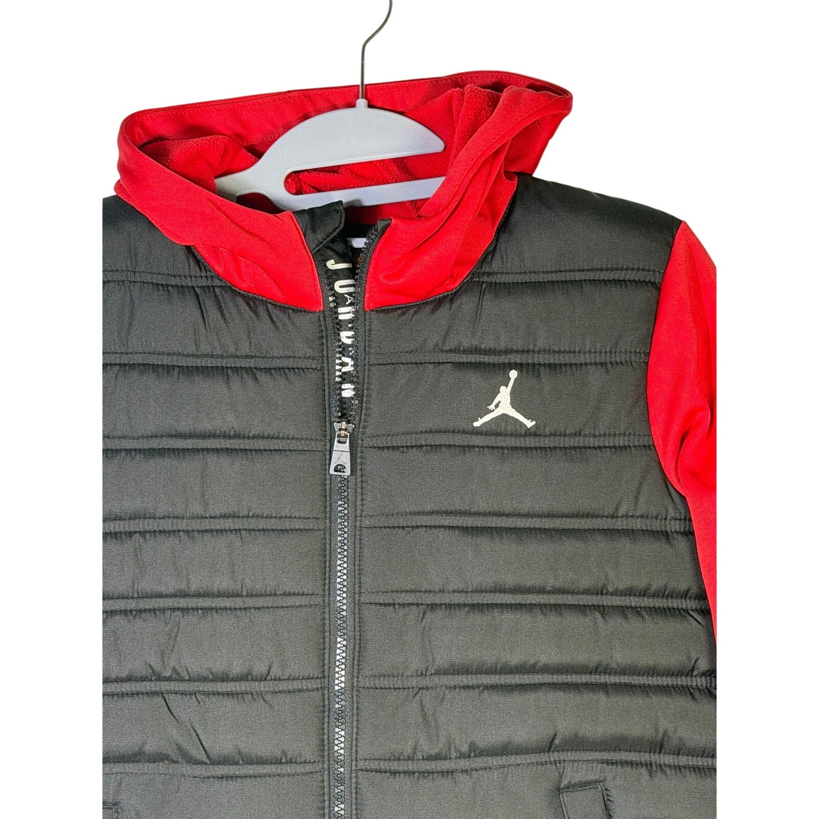 Jordan boys' black and red hybrid puffer jacket with hood, full zip, size M 10-12, lightweight and insulated.