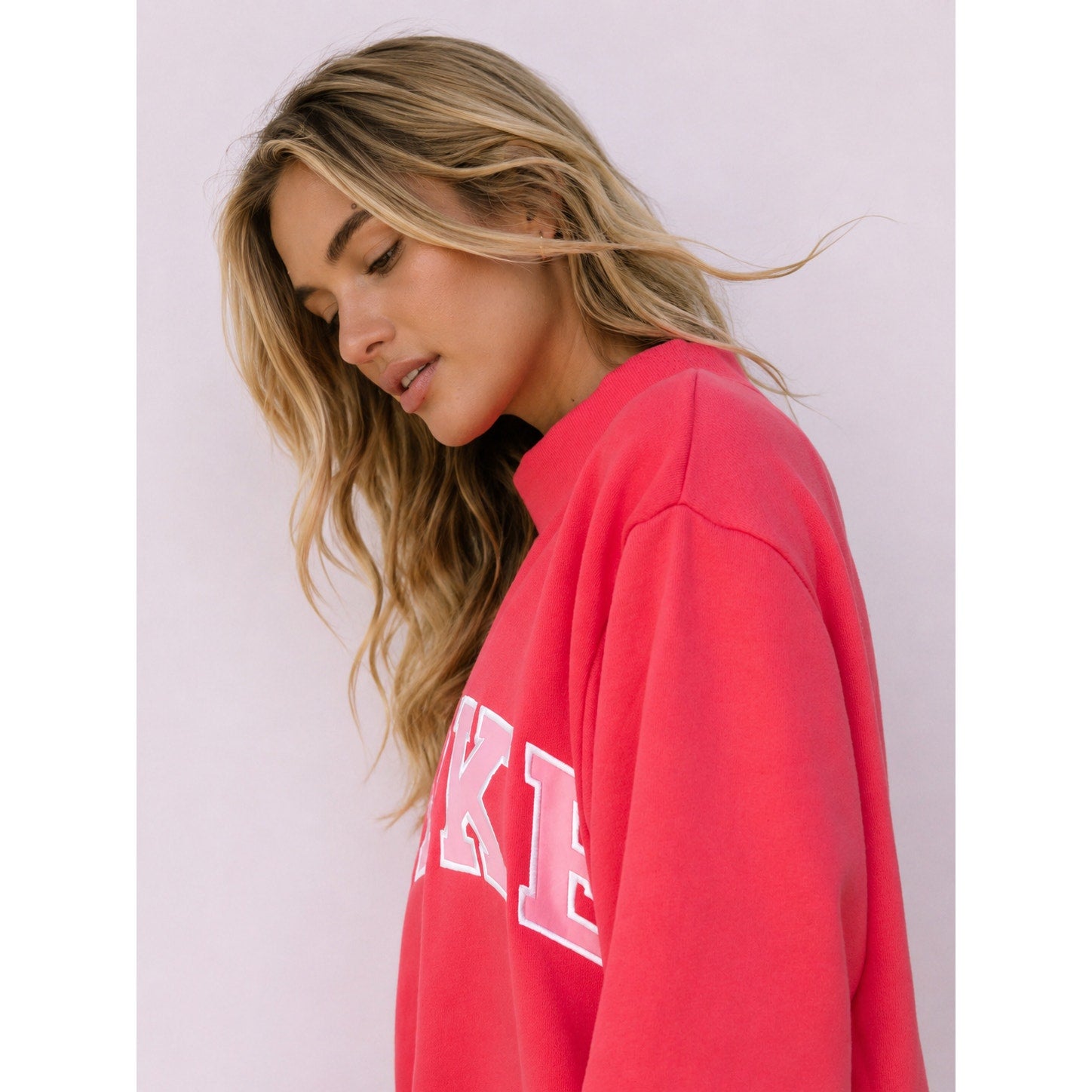Pink PARKE Heritage Varsity Mockneck Sweatshirt for women, showing the pullover fit and cozy fabric.
