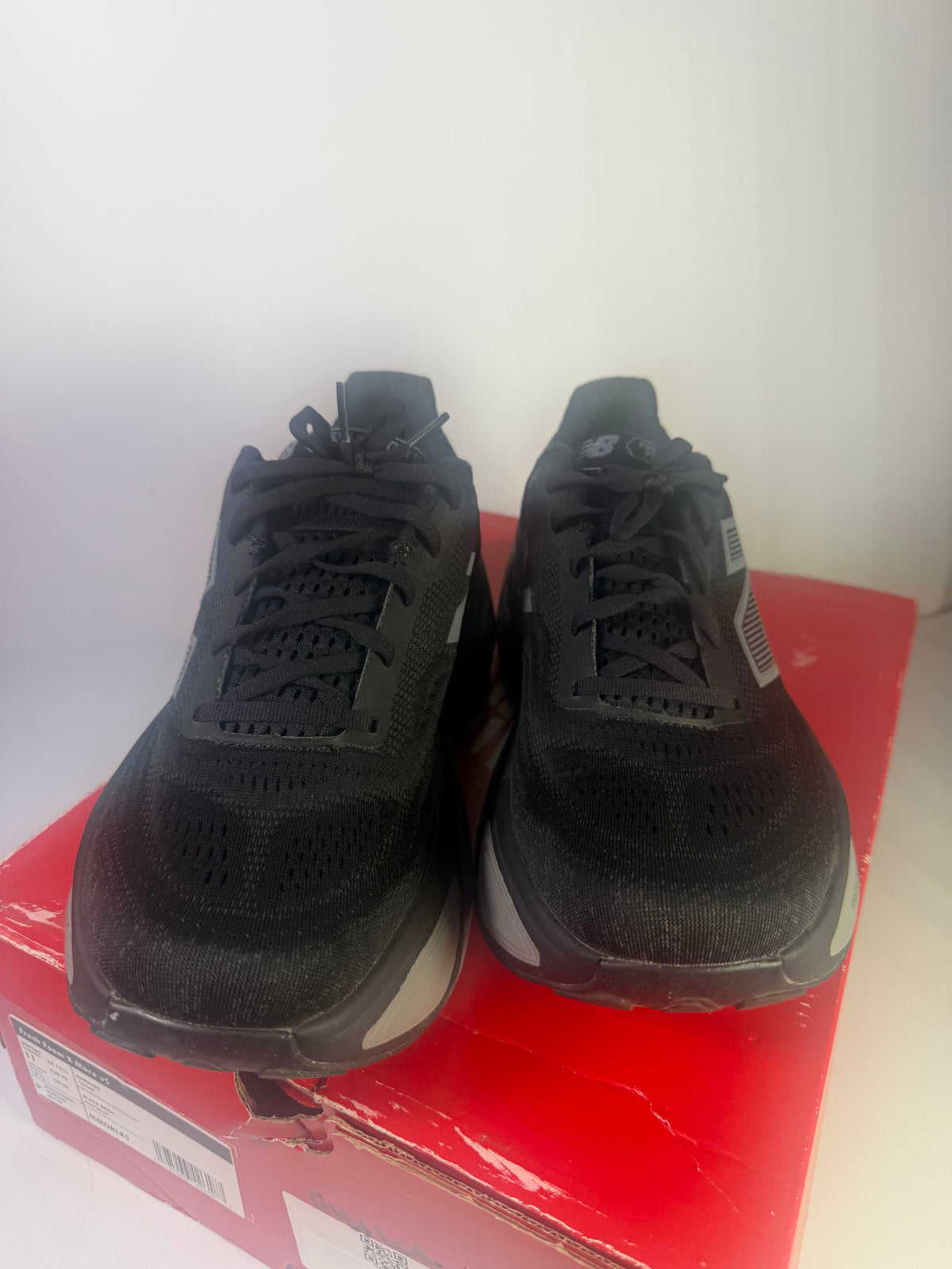 Black New Balance Fresh Foam X More v5 men's running shoes, size 11, athletic footwear with breathable mesh and cushioned sole.