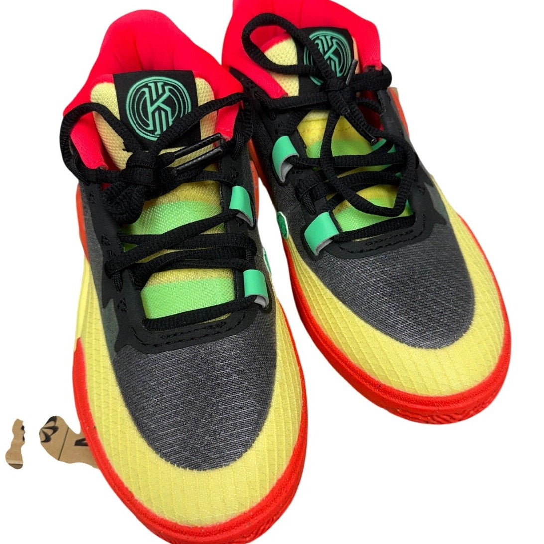 Nike Kyrie 8 GO basketball shoes for grade school in black and lemon chiffon, new in box, with sleek design and Nike branding.