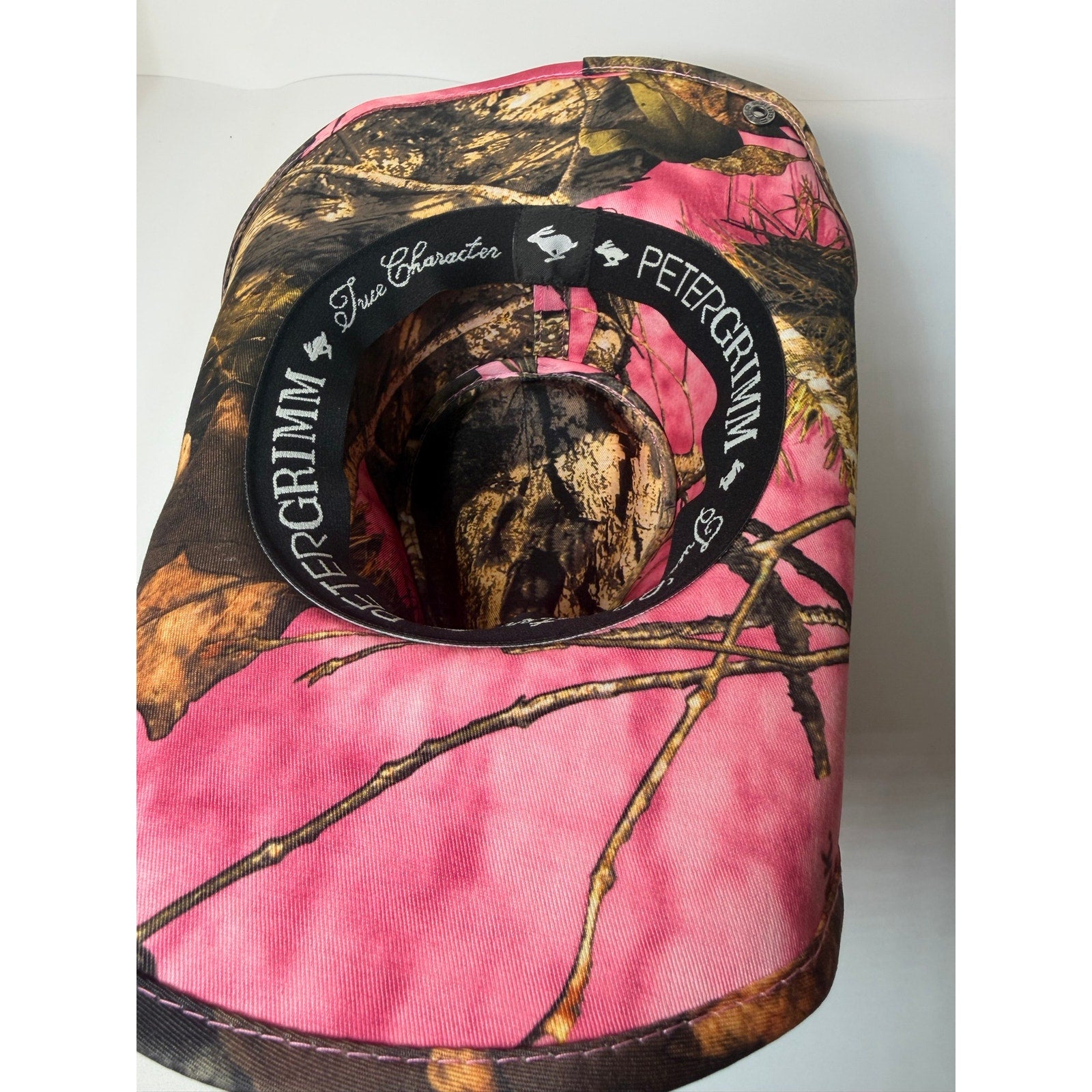 Peter Grimm women's pink camo western cowboy hat with snap-up brim and Mossy Oak pattern.