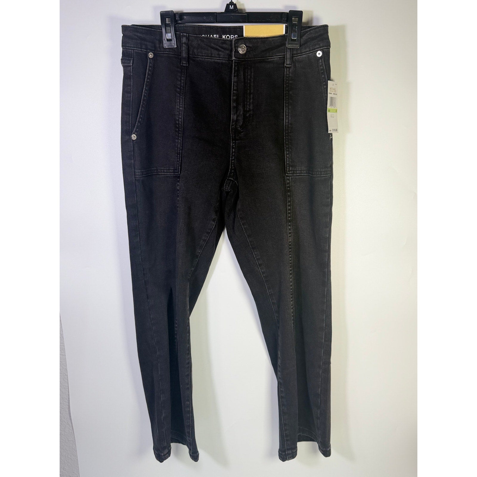 MICHAEL Michael Kors women's cropped flare jeans in washed black, size 4, with a fitted waist and flared leg style.