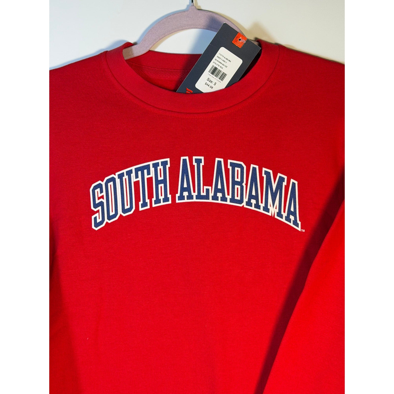 Men's South Alabama Jaguars red crewneck sweatshirt by LEAGUE with tags, showing the front view with team logo and vibrant color.