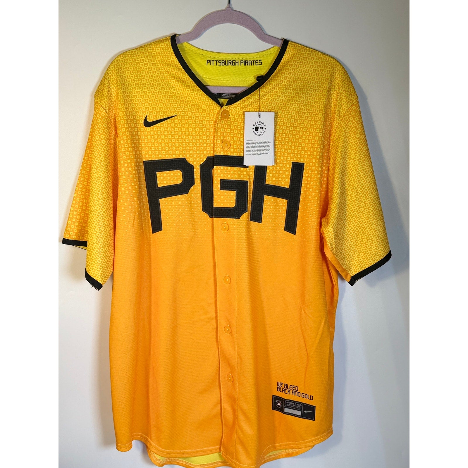 Nike Pittsburgh Pirates City Connect MLB jersey for men, large size, featuring gold fabric and team logo on front.